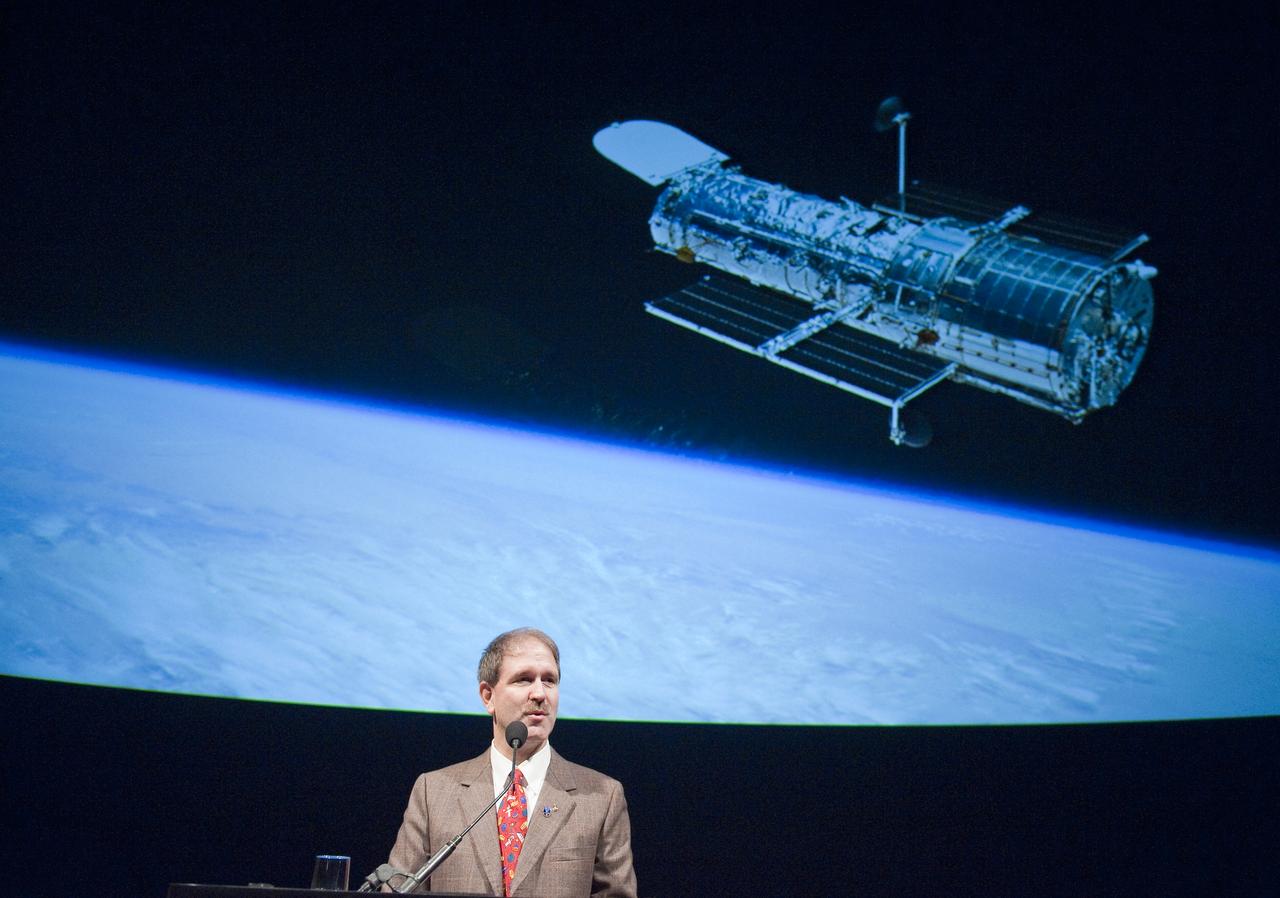 Astronaut John Grunsfeld speaks, Wednesday evening, Sept. 9, 2009, during a celebration of the Hubble Legacy at the National Air and Space Museum in Washington. Astronomers declared the Hubble Space Telescope a fully rejuvenated observatory with the release Wednesday of observations from four of its six operating science instruments. Grunsfeld, was a mission specialist aboard STS-125, the mission to repair the Hubble. Photo Credit: (NASA/Bill Ingalls)