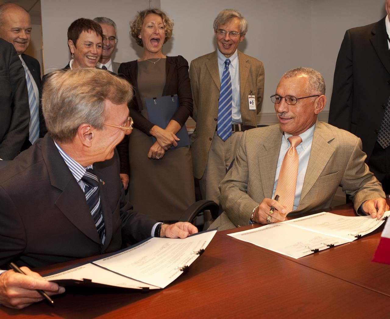 French Space Agency President Yannick d’Escatha, left, and NASA Administrator Charles Bolden joke with each other as they sign four agreements in support of U.S. and French space cooperation during a ceremony at NASA headquarters in Washington, Thursday, Sept. 17, 2009. Photo Credit: (NASA/Bill Ingalls)