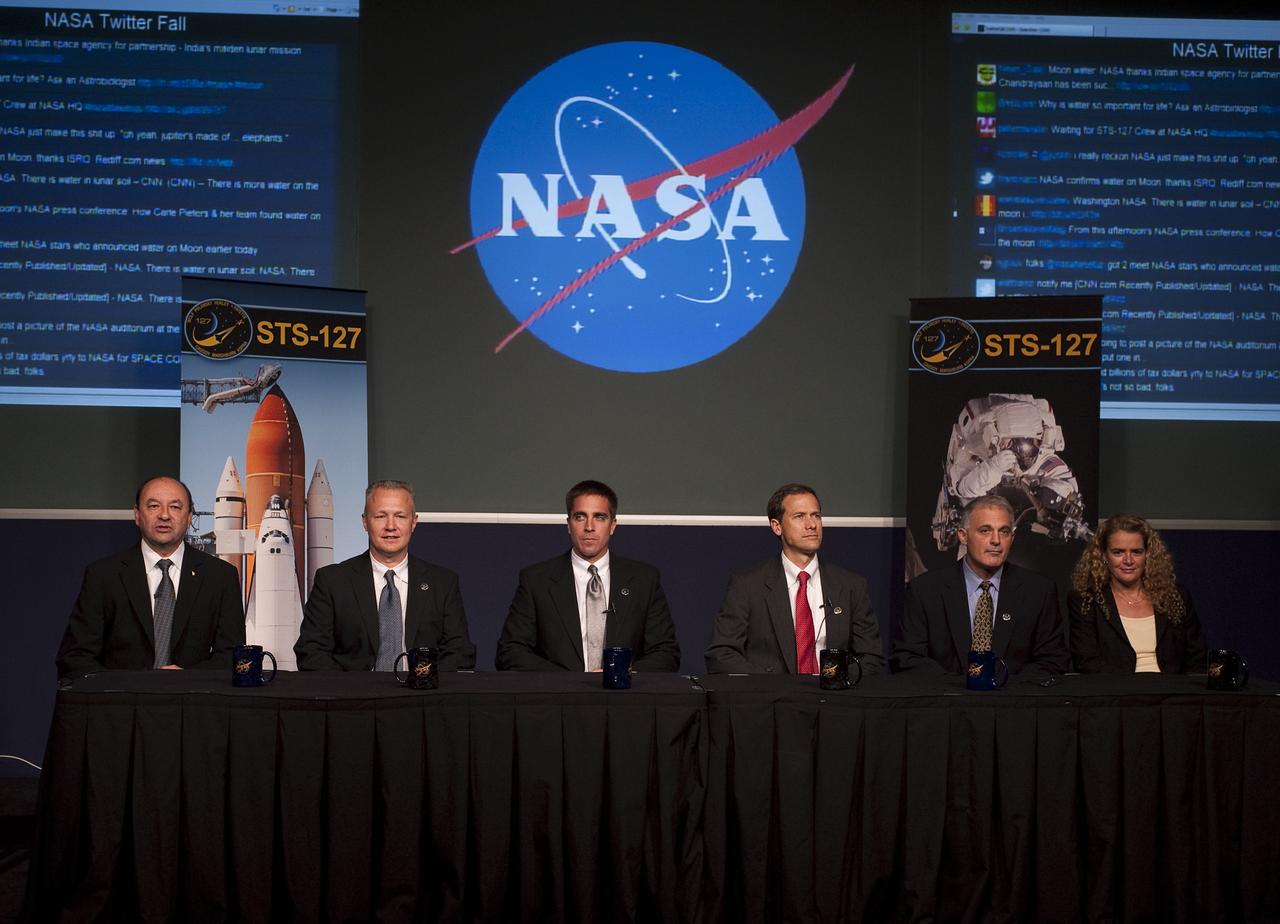 STS-127 shuttle mission crew members from left, Commander Mark Polansky, Pilot Doug Hurley, Mission Specialists Christopher Cassidy, Tom Marshburn, Dave Wolf and Julie Payette of the Canadian Space Agency, give a presentation at the NASA Tweetup event held at NASA Headquarters, September 24, 2009 in Washington. The NASA Tweetup featured a presentation and a question and answer session with the crew of the STS-127 shuttle mission to install new hardware and expand the Japanese Kibo laboratory on the International Space Station.  Photo Credit: (NASA/Carla Cioffi) 