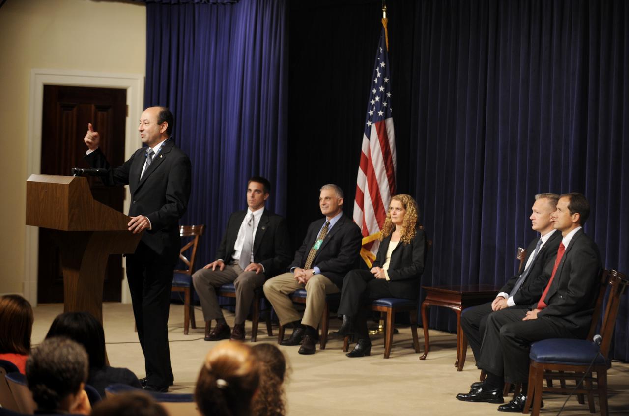 STS-127 Commander Mark Polansky, at podium, speaks to White House interns at the Eisenhower Executiive Office Building in Washington, Thursday, Sept. 24, 2009. Seated from left are crew members Christopher Cassidy, David Wolf, Julie Payette, Douglas Hurley and Thomas Marshburn. Photo Credit: (NASA/Paul E. Alers)