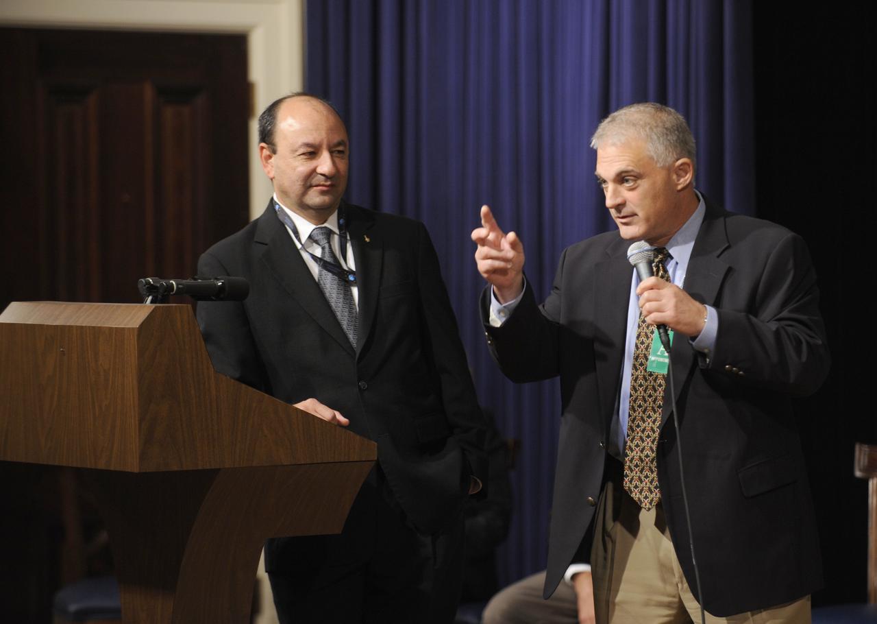 STS-127 Commander Mark Polansky, left, looks on as crew member David Wolf answer a question during a presentation to White House interns at the Eisenhower Executiive Office Building in Washington, Thursday, Sept. 24, 2009. Photo Credit: (NASA/Paul E. Alers)