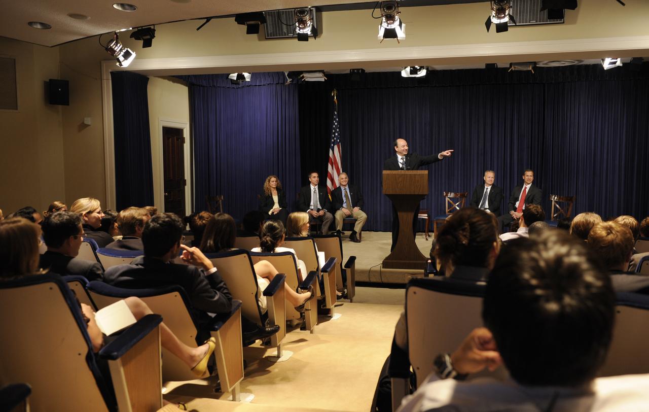 STS-127 Commander Mark Polansky, at podium, speaks to White House interns at the Eisenhower Executiive Office Building in Washington, Thursday, Sept. 24, 2009. Seated from left are crew members Christopher Cassidy, David Wolf, Julie Payette, Douglas Hurley and Thomas Marshburn. Photo Credit: (NASA/Paul E. Alers)
