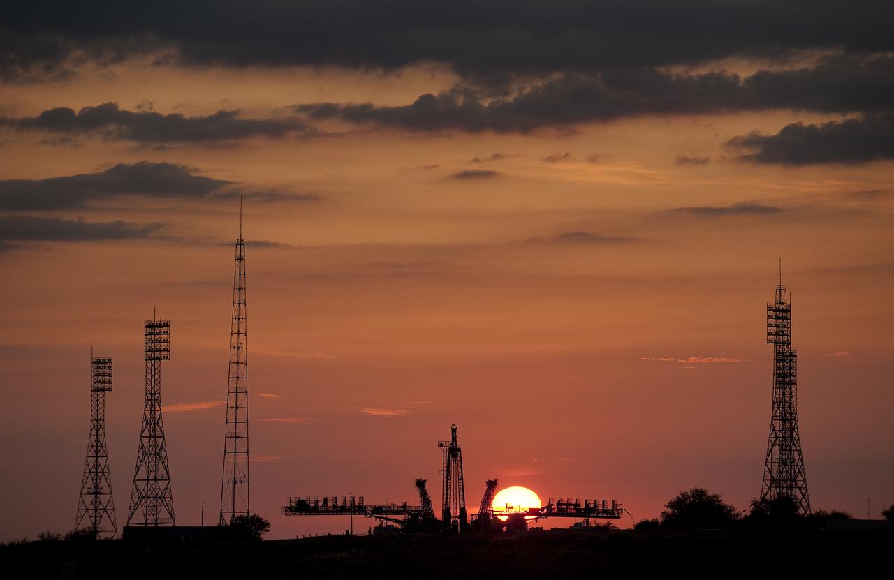 The sun rises behind the Soyuz launch pad shortly before the Soyuz rocket is rolled out to the launch pad Monday, Sept. 28, 2009 at the Baikonur Cosmodrome in Kazakhstan.  The Soyuz is scheduled to launch the crew of Expedition 21 and a spaceflight participant on Sept. 30, 2009.  Photo Credit: (NASA/Bill Ingalls)