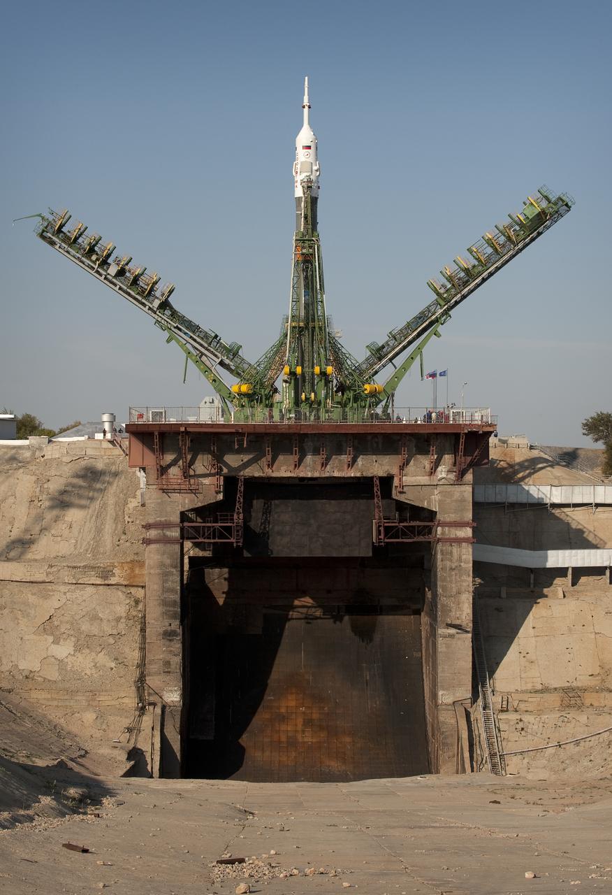 Launch scaffolding is raised into place around the Soyuz rocket shortly after arrival to the launch pad Monday, Sept. 28, 2009 at the Baikonur Cosmodrome in Kazakhstan. The Soyuz is scheduled to launch the crew of Expedition 21 and a spaceflight participant on Sept. 30, 2009. Photo Credit: (NASA/Bill Ingalls)