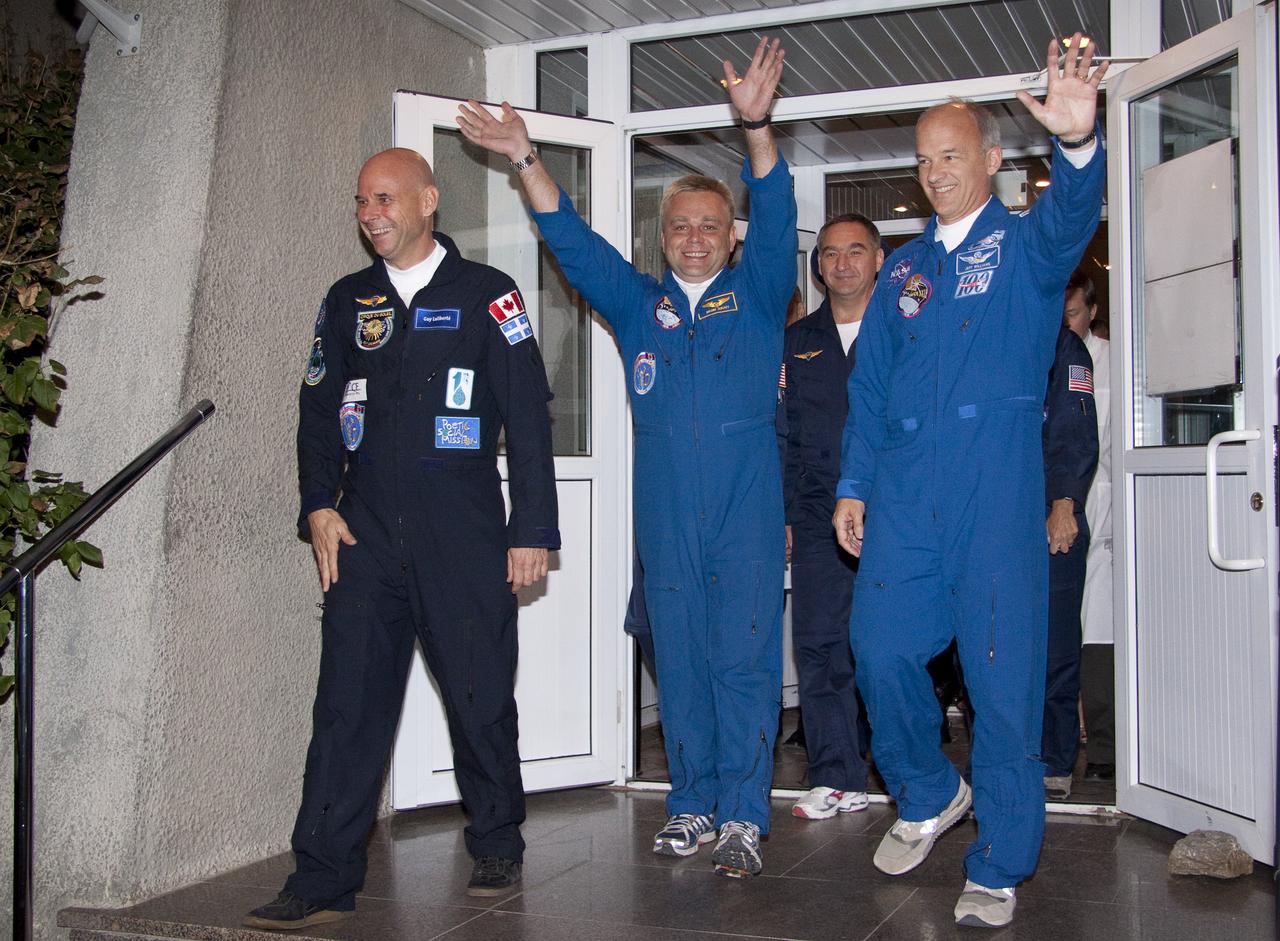 Spaceflight Participant Guy Laliberté, left, Expedition 21 Flight Engineer Maxim Suraev, center, and Expedition 21 Flight Engineer Jeffrey N. Williams depart the Cosmonaut Hotel on the morning of their Soyuz launch to the International Space Station on Wednesday, Sept. 30, 2009 in Baikonur, Kazakhstan. Photo Credit: (NASA/Victor Zelentsov)