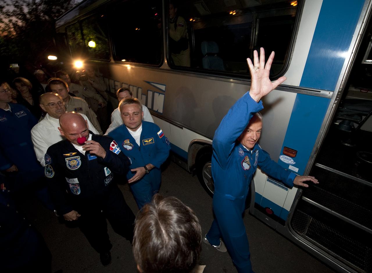 Spaceflight Participant Guy Laliberté, left, Expedition 21 Flight Engineer Maxim Suraev, center, and Expedition 21 Flight Engineer Jeffrey N. Williams depart the Cosmonaut Hotel on the morning of their Soyuz launch to the International Space Station on Wednesday, Sept. 30, 2009 in Baikonur, Kazakhstan. Photo Credit: (NASA/Bill Ingalls)