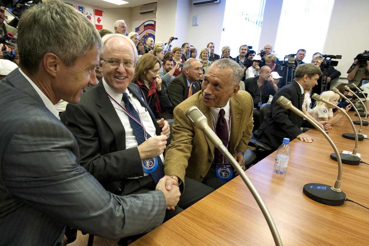 Chief, State Organization, Gagarin Research and Test Cosmonaut Training Center, Sergei Krikalev, left, Ambassador of the United States of America to the Russian Federation, John Beyrle, center, and NASA Administrator Charles Bolden say hello to each other prior to talking to Expedition 21 crew members Maxim Suraev, Jeffrey N. Williams and Spaceflight Participant Guy Laliberté, Wednesday, Sept. 30, 2009 in Baikonur, Kazakhstan. Photo Credit: (NASA/Bill Ingalls)