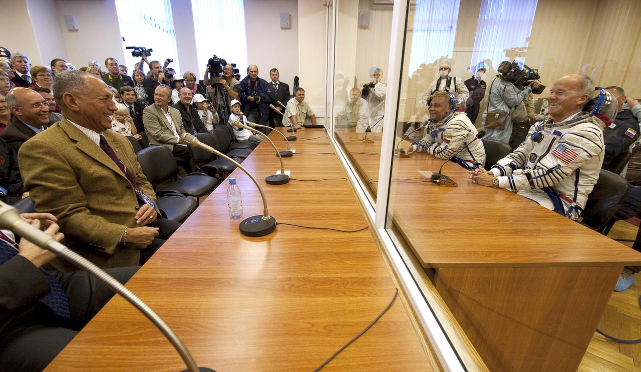 NASA Administrator Charles Bolden, left, laughs with Expedition 21 Flight Engineer Maxim Suraev, center, and Expedition 21 Flight Engineer Jeffrey N. Williams, right as Spaceflight Participant Guy Laliberté has his Russian Sokol suit pressure checked, Wednesday, Sept. 30, 2009 in Baikonur, Kazakhstan. Photo Credit: (NASA/Bill Ingalls)