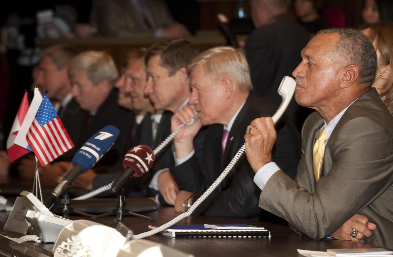 NASA Administrator Charles Bolden, right, holds the phone while Head of the Russian Federal Space Agency, Anatoly Perminov, talks to the crew of the International Spacer Station (ISS) from the Mission Control Center Moscow in Korolev, Russia shortly after the successful docking of the Soyuz TMA-16 spacecraft with the International Space Station marking the start of Expedition 21 with Flight Engineer Jeffrey N. Williams, Expedition 21 Flight Engineer Maxim Suraev, and Spaceflight Participant Guy Laliberté, Friday, Oct. 2, 2009. Photo Credit: (NASA/Bill Ingalls)