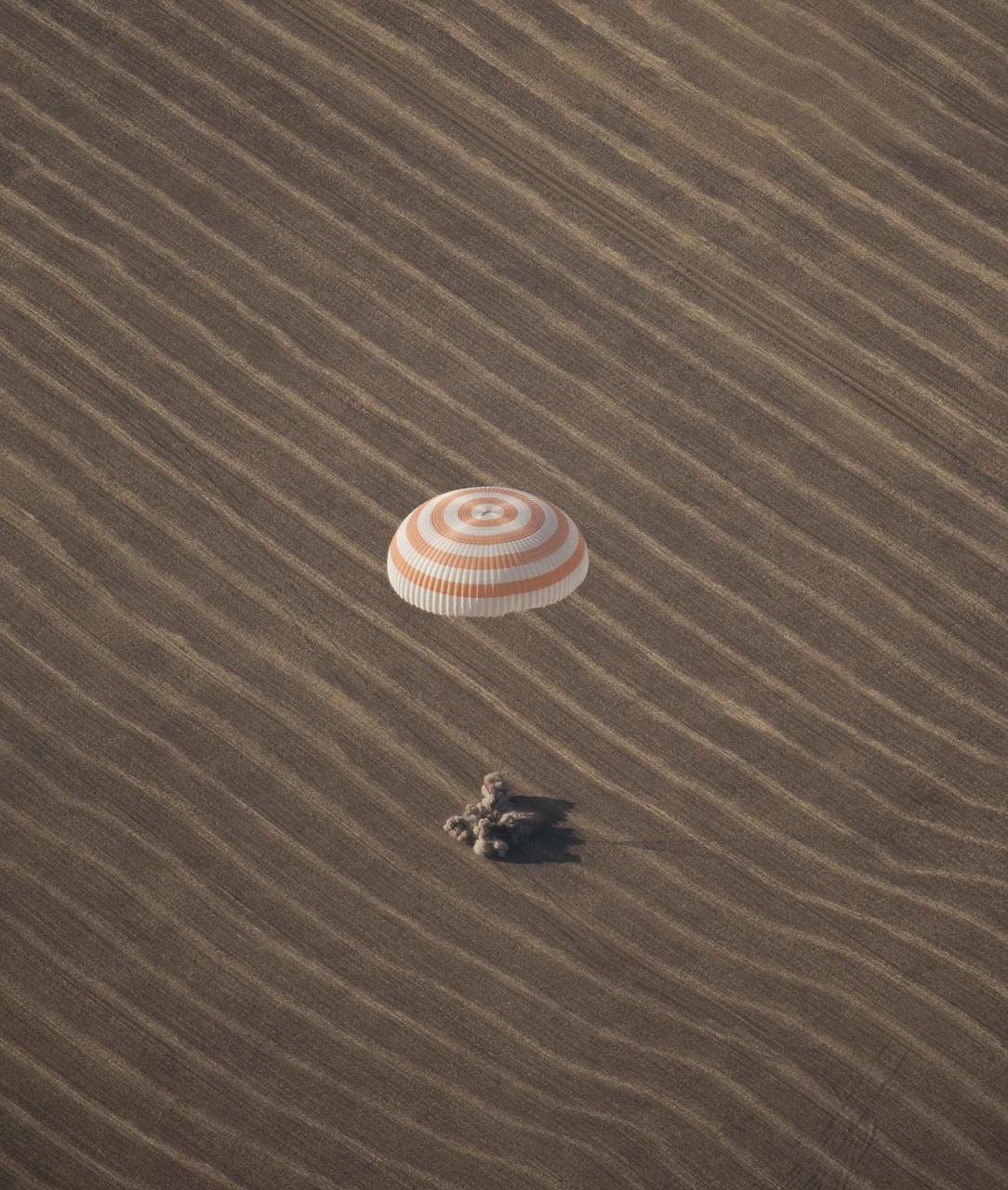 The Soyuz TMA-14 spacecraft is seen as it lands with Expedition 20 Commander Gennady Padalka, Flight Engineer Michael Barratt, and spaceflight participant Guy Laliberté near the town of Arkalyk, Kazakhstan on Sunday, Oct. 11, 2009. Padalka and Barratt are returning from six months onboard the International Space Station, along with Laliberté who arrived at the station on Oct. 2 with Expedition 21 Flight Engineers Jeff Williams and Maxim Suraev aboard the Soyuz TMA-16 spacecraft. Photo Credit: (NASA/Bill Ingalls)
