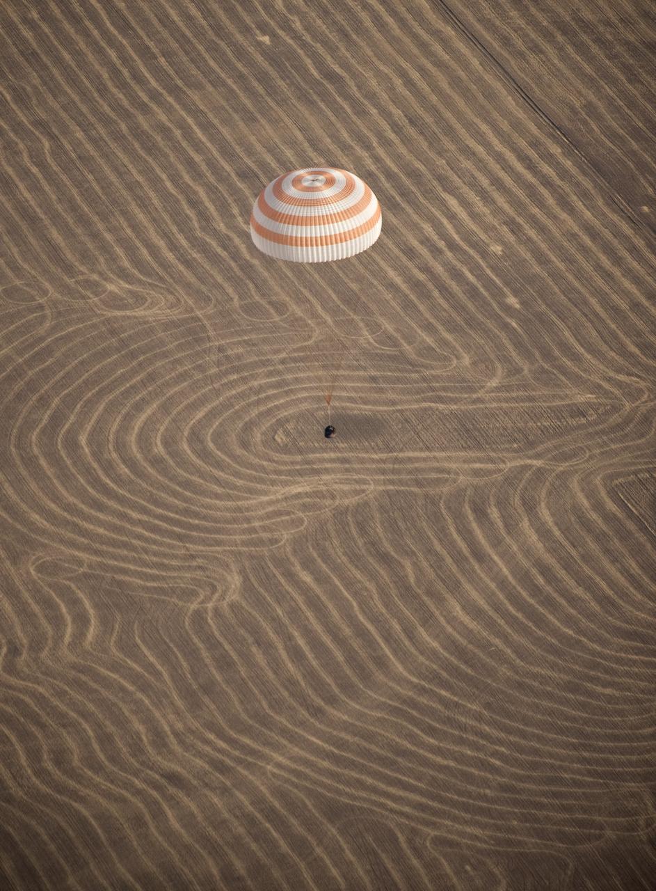 The Soyuz TMA-14 spacecraft is seen as it lands with Expedition 20 Commander Gennady Padalka, Flight Engineer Michael Barratt, and spaceflight participant Guy Laliberté near the town of Arkalyk, Kazakhstan on Sunday, Oct. 11, 2009. Padalka and Barratt are returning from six months onboard the International Space Station, along with Laliberté who arrived at the station on Oct. 2 with Expedition 21 Flight Engineers Jeff Williams and Maxim Suraev aboard the Soyuz TMA-16 spacecraft. Photo Credit: (NASA/Bill Ingalls)