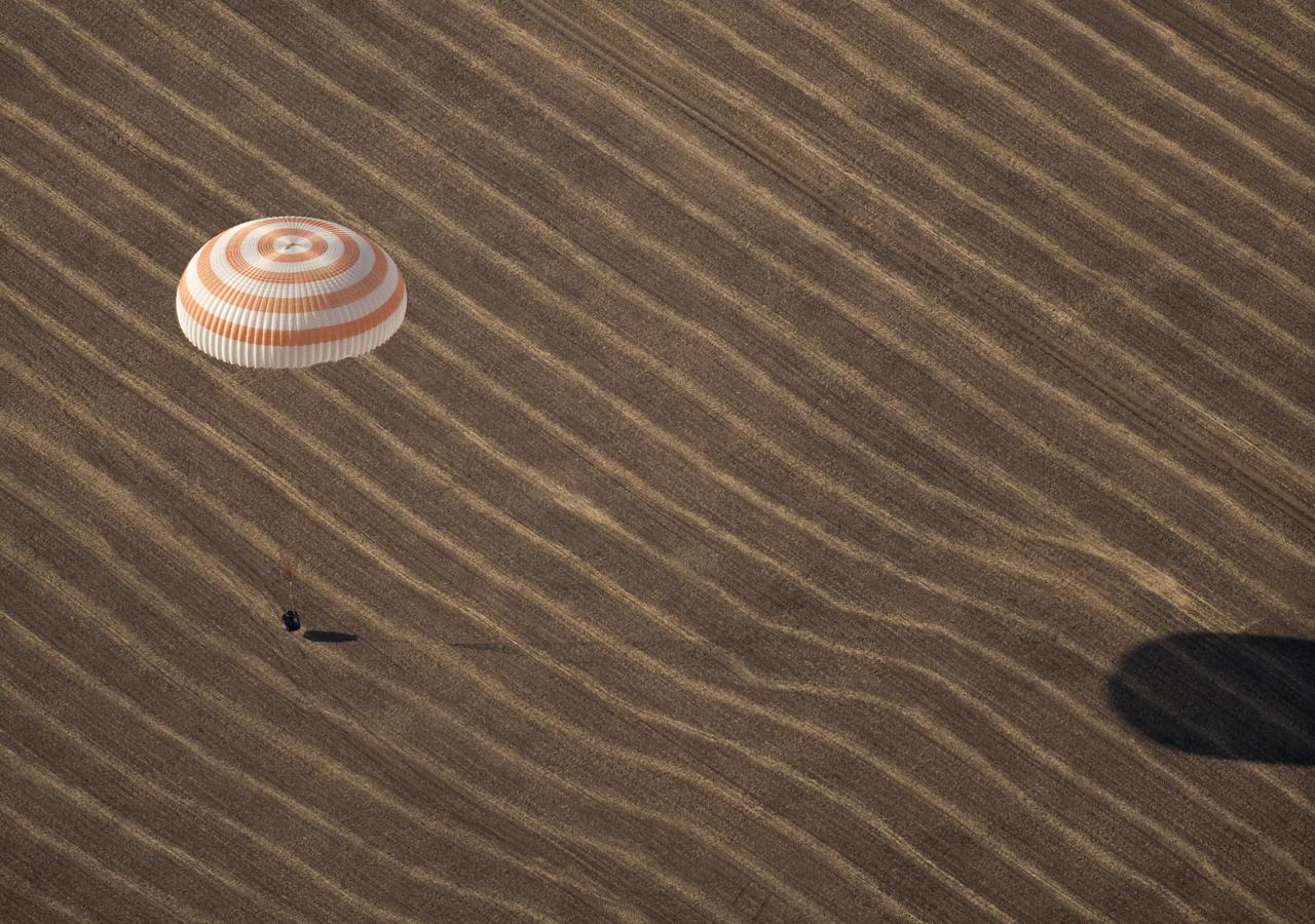 The Soyuz TMA-14 spacecraft is seen as it lands with Expedition 20 Commander Gennady Padalka, Flight Engineer Michael Barratt, and spaceflight participant Guy Laliberté near the town of Arkalyk, Kazakhstan on Sunday, Oct. 11, 2009. Padalka and Barratt are returning from six months onboard the International Space Station, along with Laliberté who arrived at the station on Oct. 2 with Expedition 21 Flight Engineers Jeff Williams and Maxim Suraev aboard the Soyuz TMA-16 spacecraft. Photo Credit: (NASA/Bill Ingalls)