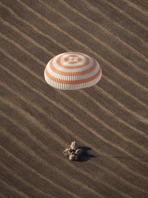 The Soyuz TMA-14 spacecraft is seen as it lands with Expedition 20 Commander Gennady Padalka, Flight Engineer Michael Barratt, and spaceflight participant Guy Laliberté near the town of Arkalyk, Kazakhstan on Sunday, Oct. 11, 2009. Padalka and Barratt are returning from six months onboard the International Space Station, along with Laliberté who arrived at the station on Oct. 2 with Expedition 21 Flight Engineers Jeff Williams and Maxim Suraev aboard the Soyuz TMA-16 spacecraft. Photo Credit: (NASA/Bill Ingalls)