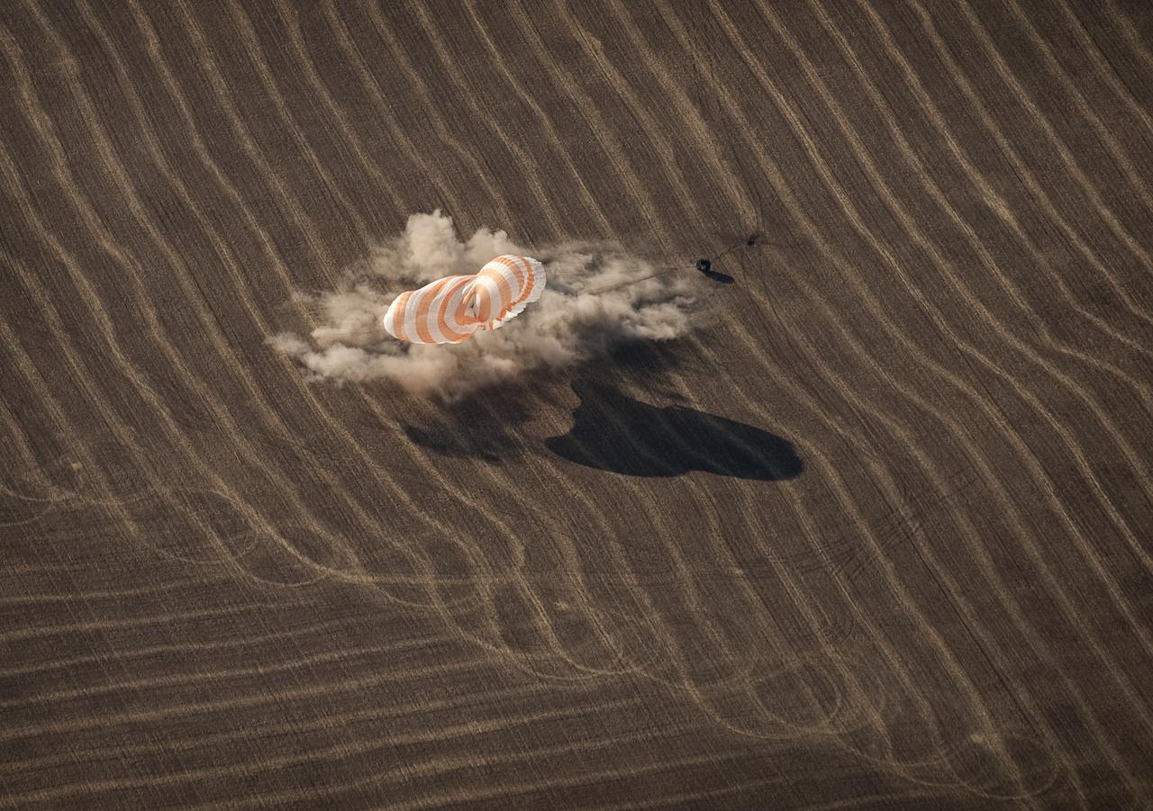 The Soyuz TMA-14 spacecraft is seen as it lands with Expedition 20 Commander Gennady Padalka, Flight Engineer Michael Barratt, and spaceflight participant Guy Laliberté near the town of Arkalyk, Kazakhstan on Sunday, Oct. 11, 2009. Padalka and Barratt are returning from six months onboard the International Space Station, along with Laliberté who arrived at the station on Oct. 2 with Expedition 21 Flight Engineers Jeff Williams and Maxim Suraev aboard the Soyuz TMA-16 spacecraft. Photo Credit: (NASA/Bill Ingalls)