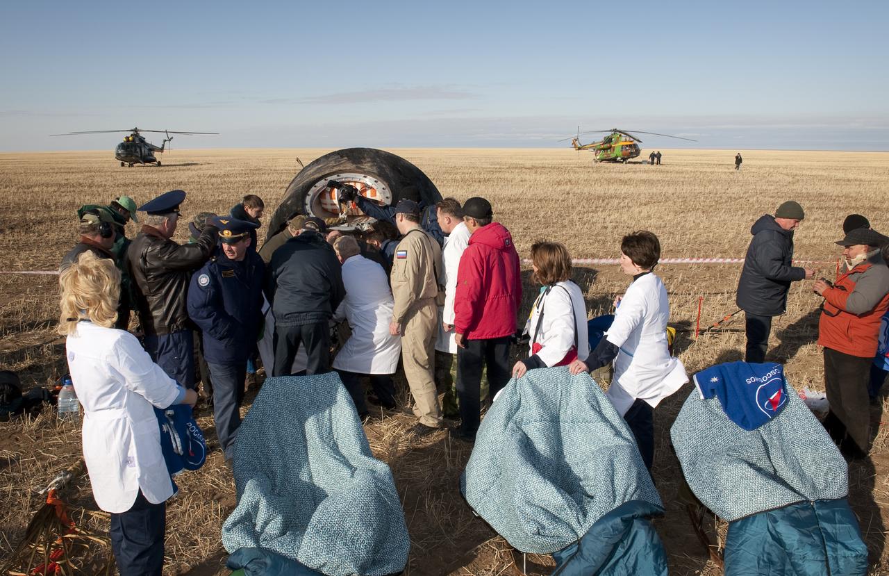 Empty chairs outside the Soyuz Capsule await Spaceflight participant Guy Laliberté, Expedition 20 Commander Gennady Padalka, and Expedition 20 Flight Engineer Michael Barratt just minutes after they landed in their Soyuz TMA-14 capsule near the town of Arkalyk, Kazakhstan on Sunday, Oct. 11, 2009. Padalka and Barratt are returning from six months onboard the International Space Station, along with Laliberté who arrived at the station on Oct. 2 with Expedition 21 Flight Engineers Jeff Williams and Maxim Suraev aboard the Soyuz TMA-16 spacecraft. Photo Credit: (NASA/Bill Ingalls)
