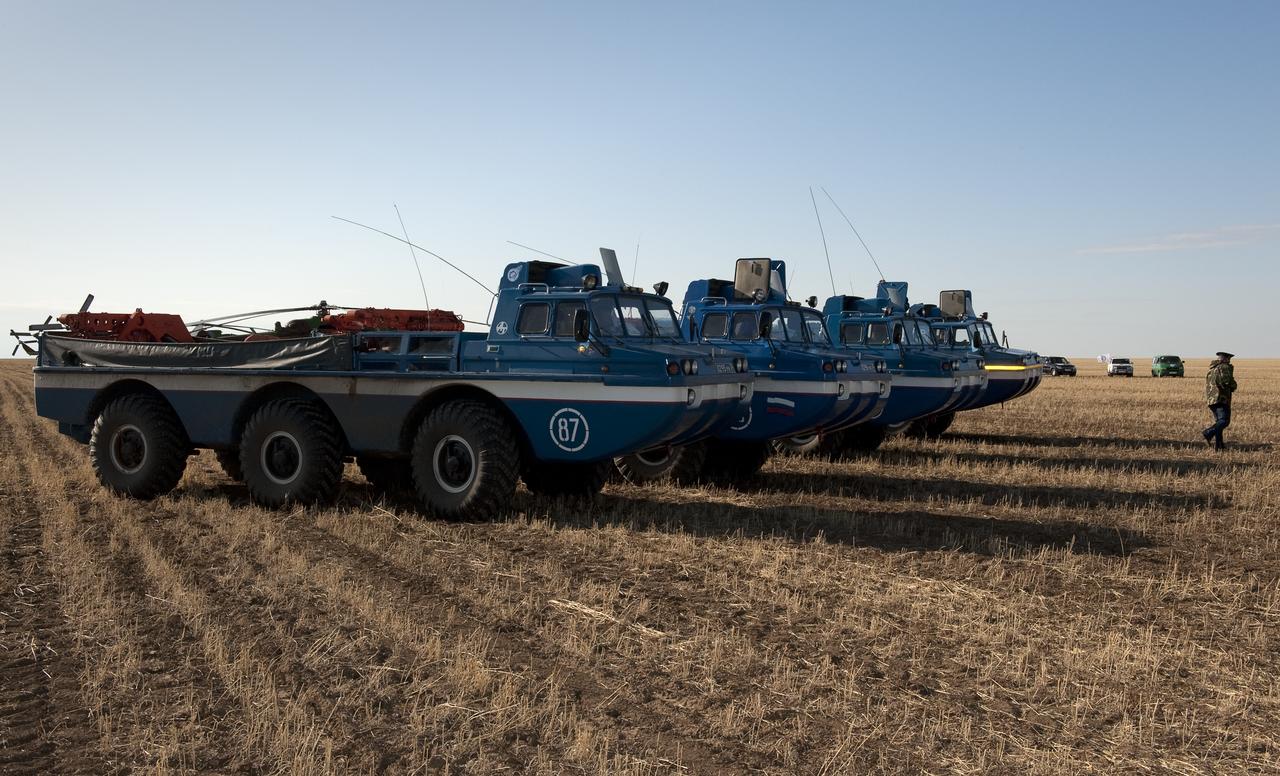 Russian Search and Rescue team All Terrain Vehicles (ATVs) are seen parked at the landing site of the Soyuz TMA-14 capsule that carried Expedition 20 Commander Gennady Padalka, Flight Engineer Michael Barratt, and spaceflight participant Guy Laliberté near the town of Arkalyk, Kazakhstan on Sunday, Oct. 11, 2009. Padalka and Barratt are returning from six months onboard the International Space Station, along with Laliberté who arrived at the station on Oct. 2 with Expedition 21 Flight Engineers Jeff Williams and Maxim Suraev aboard the Soyuz TMA-16 spacecraft. Photo Credit: (NASA/Bill Ingalls)