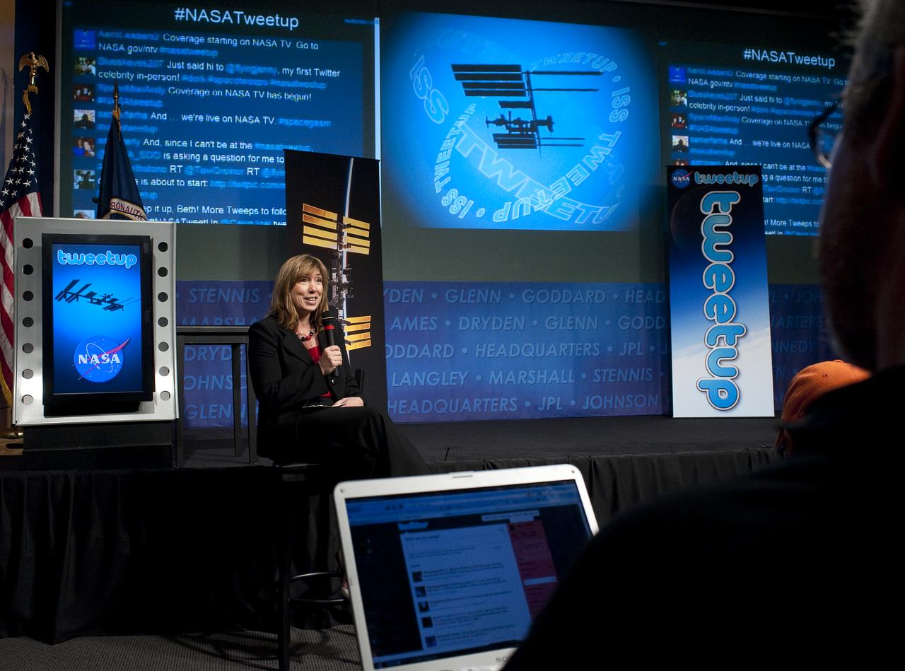 NASA Deputy Administrator Lori Garver welcomes attendees to a live Tweetup event at NASA Headquarters in Washington with astronauts living aboard the International Space Station (ISS), Wednesday, Oct. 21, 2009.  Photo Credit: (NASA/Carla Cioffi)