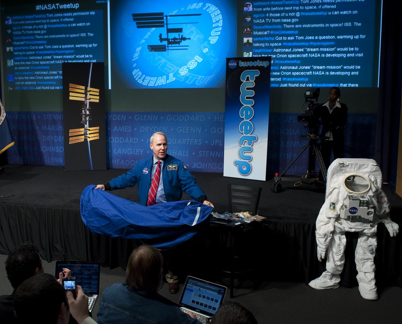 Former NASA astronaut Tom Jones shows off a sleeping bag used by astronauts living aboard the International Space Station during a NASA Tweetup event at NASA Headquarters in Washington, Wednesday, Oct. 21, 2009.  Photo Credit: (NASA/Carla Cioffi)