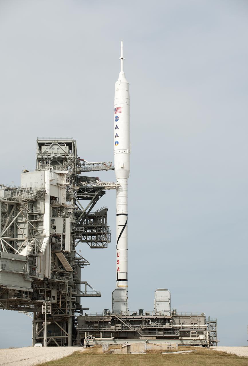 NASA's Ares I-X rocket is seen on launch pad 39b at the Kennedy Space Center in Cape Canaveral, Fla., Tuesday, Oct. 27, 2009 shortly after NASA scrubbed the launch attempt due to weather.  The flight test of Ares I-X, now scheduled for Wednesday, Oct. 28, 2009, will provide NASA with an early opportunity to test and prove flight characteristics, hardware, facilities and ground operations associated with the Ares I.  Photo Credit: (NASA/Bill Ingalls)