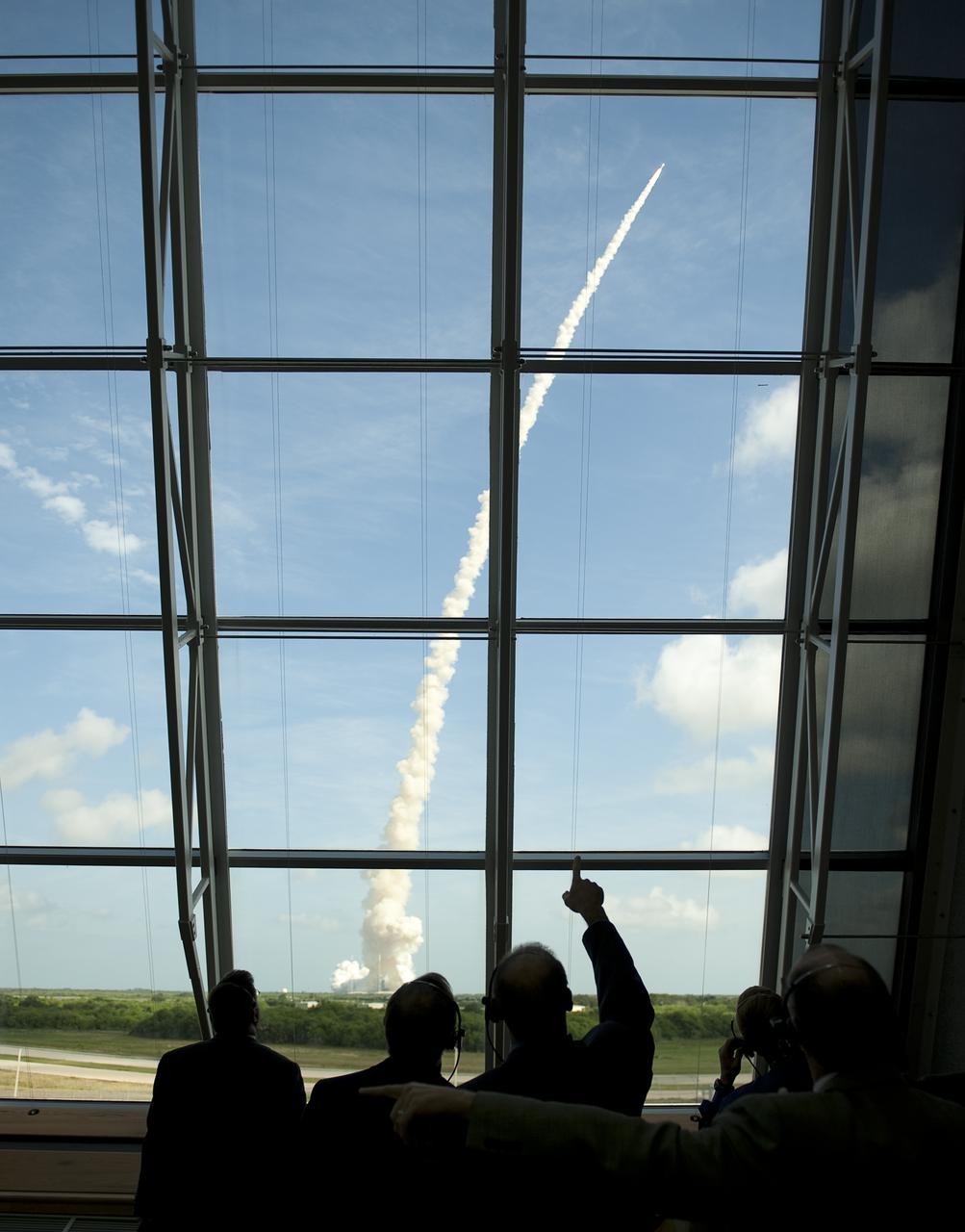 NASA Ares I-X mission managers watch as NASA's Ares I-X rocket launches from pad 39b at the Kennedy Space Center in Cape Canaveral, Fla., Wednesday, Oct. 28, 2009.  The flight test will provide NASA with an early opportunity to test and prove flight characteristics, hardware, facilities and ground operations associated with the Ares I.  Photo Credit: (NASA/Bill Ingalls)