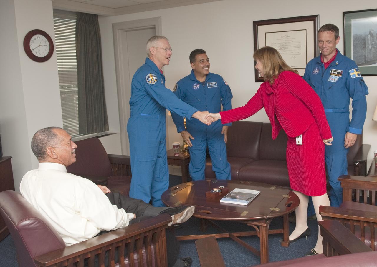 NASA Administrator Charles F. Bolden, seated left, smiles as Deputy Administrator Lori Garver greets STS-128 astronauts Patrick Forrester, Jose Hernandez and Christer Fugelsang, of the European Space Agency, during a meeting at NASA Headquarters, Tuesday, Nov. 3, 2009, in Washington. Photo Credit: (NASA/Paul E. Alers)