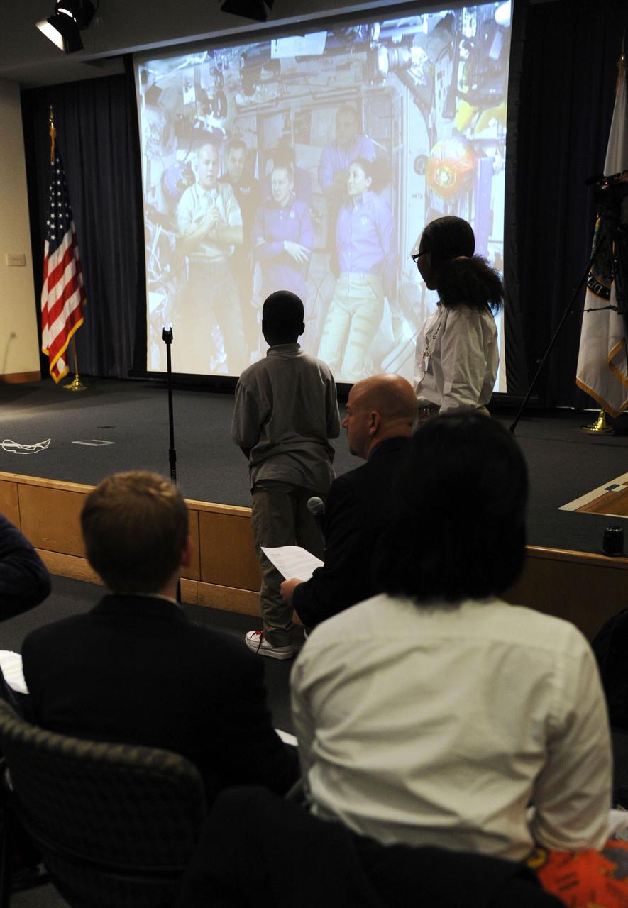 Students speak with astronauts on the International Space Station (ISS) via downlink during an event at the U.S. Department of Education, Thursday, Nov. 5, 2009, in Washington. NASA Administrator Charles Bolden and Secretary of Education Arne Duncan hosted Washington area middle and high school students Thursday for a live discussion with astronauts aboard the International Space Station. The event was part of the 10th annual celebration of International Education Week. Photo Credit: (NASA/Paul E. Alers)