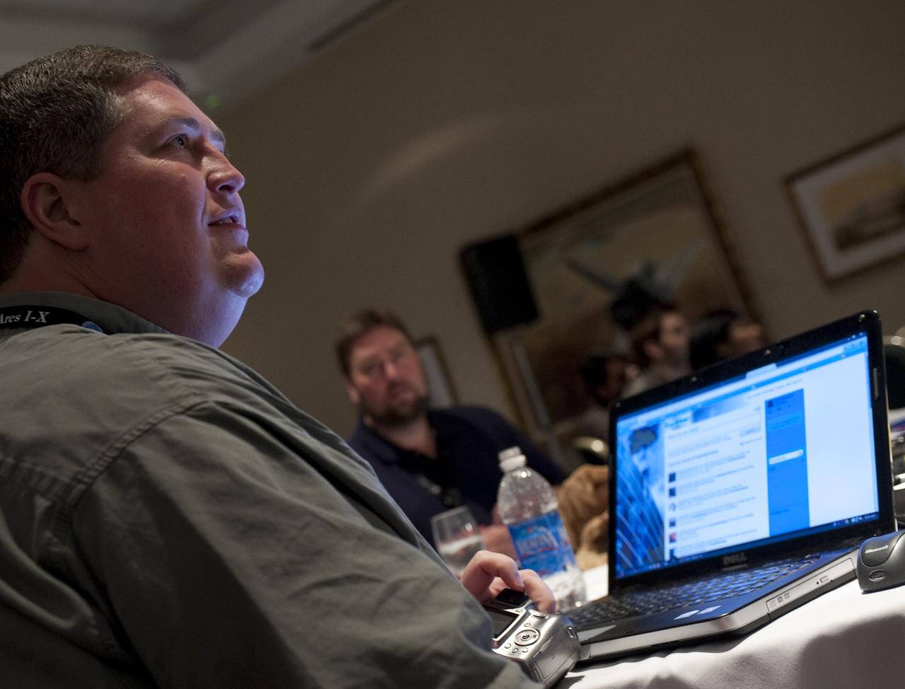 Twitter user Dave Gibson from Lawrenceville, GA, who goes by the twitter name @davecgibson, listens to a guest speaker during a two-day NASA Tweetup event held at NASA's Kennedy Space Center in Cape Canaveral, Fla, Sunday, Nov. 15, 2009. NASA Twitter followers in attendance will have the opportunity to take a tour of NASA's Kennedy Space Center, view the STS-129 space shuttle launch and speak with shuttle technicians, engineers, astronauts and managers.  Photo Credit: (NASA/Carla Cioffi)