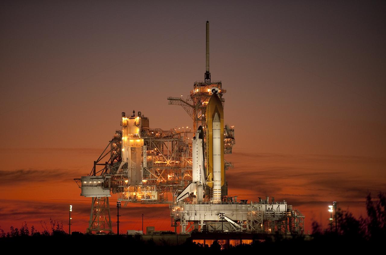 The space shuttle Atlantis is seen on launch pad 39a of the NASA Kennedy Space Center shortly after the rotating service structure was rolled back, Sunday, Nov. 15, 2009, Cape Canaveral, FL.  Atlantis is scheduled to launch at 2:28p.m. EST, Monday, Nov. 16, 2009. Photo Credit: (NASA/Bill Ingalls)