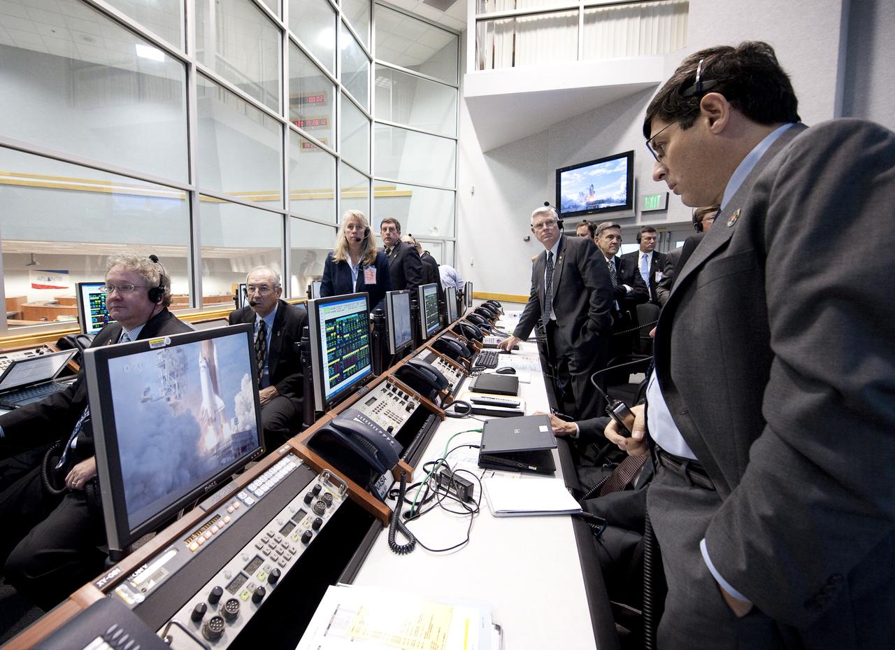 NASA Associate Administrator Chris Scolese monitors the launch of the space shuttle Atlantis from firing room four of the NASA Kennedy Space Center, Monday, Nov. 16, 2009, Cape Canaveral, FL.  Space shuttle Atlantis and its six-member crew began the 11-day STS-129 mission to the International Space Station. The shuttle will transport spare hardware to the outpost and return a station crew member who spent more than two months in space.  Photo Credit: (NASA/Bill Ingalls)