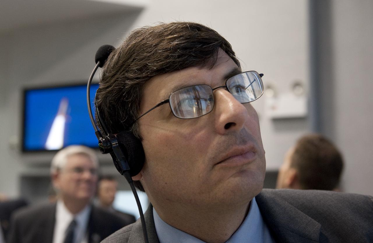 NASA Associate Administrator Chris Scolese monitors the launch of the space shuttle Atlantis from firing room four of the NASA Kennedy Space Center, Monday, Nov. 16, 2009, Cape Canaveral, FL.  Space shuttle Atlantis and its six-member crew began the 11-day STS-129 mission to the International Space Station. The shuttle will transport spare hardware to the outpost and return a station crew member who spent more than two months in space.  Photo Credit: (NASA/Bill Ingalls)