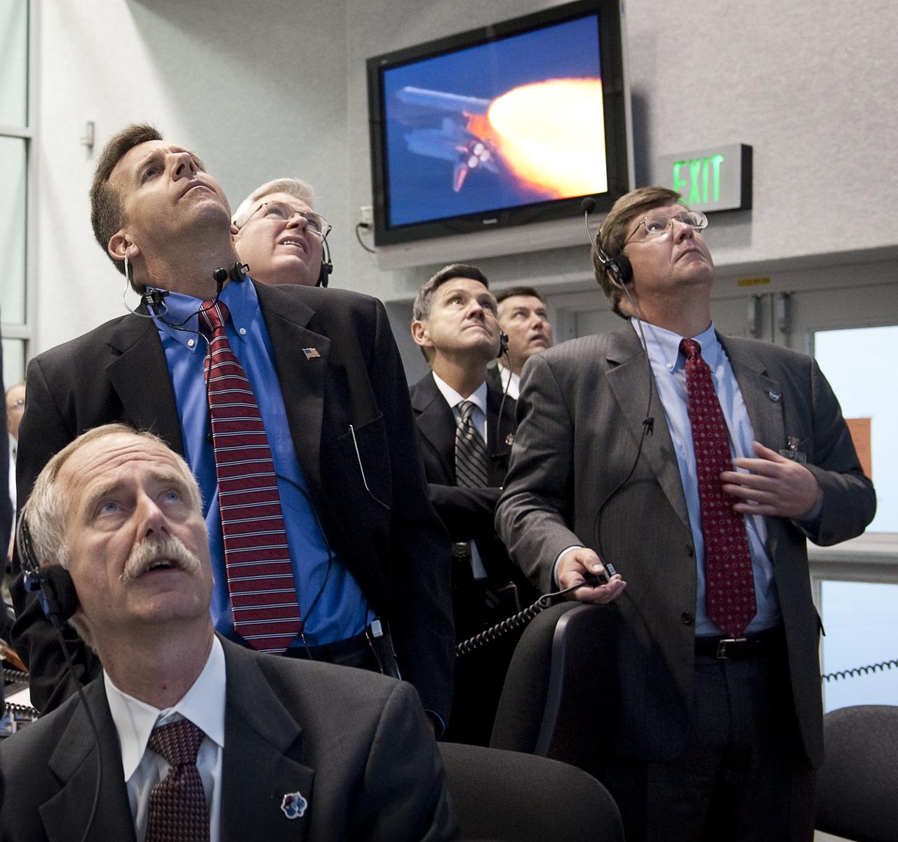 NASA mission managers monitor the launch of the space shuttle Atlantis from firing room four of the NASA Kennedy Space Center, Monday, Nov. 16, 2009, Cape Canaveral, FL.  Space shuttle Atlantis and its six-member crew began the 11-day STS-129 mission to the International Space Station. The shuttle will transport spare hardware to the outpost and return a station crew member who spent more than two months in space.  Photo Credit: (NASA/Bill Ingalls)