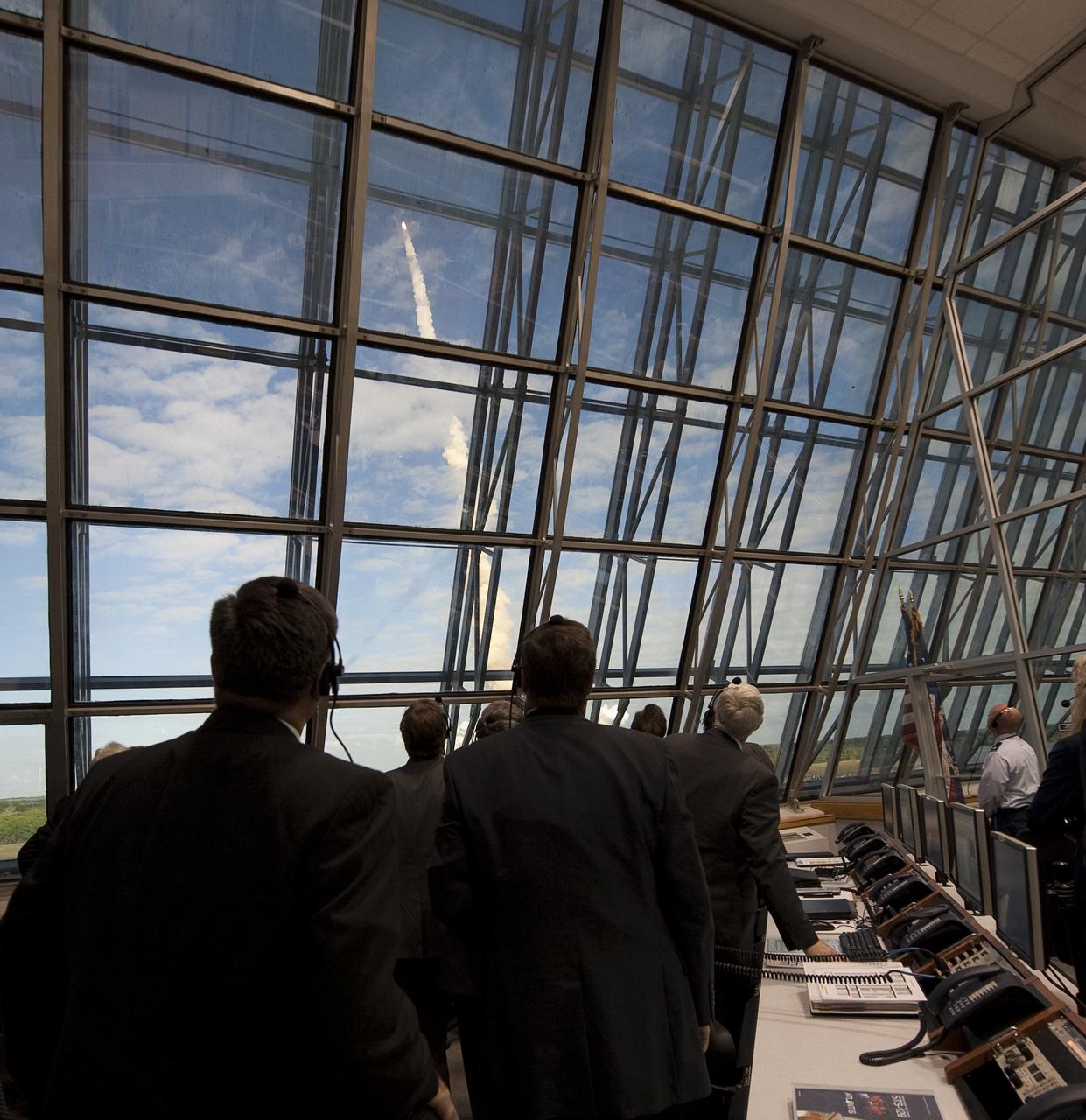 NASA mission managers monitor the launch of the space shuttle Atlantis from firing room four of the NASA Kennedy Space Center, Monday, Nov. 16, 2009, Cape Canaveral, FL.  Space shuttle Atlantis and its six-member crew began the 11-day STS-129 mission to the International Space Station. The shuttle will transport spare hardware to the outpost and return a station crew member who spent more than two months in space.  Photo Credit: (NASA/Bill Ingalls)
