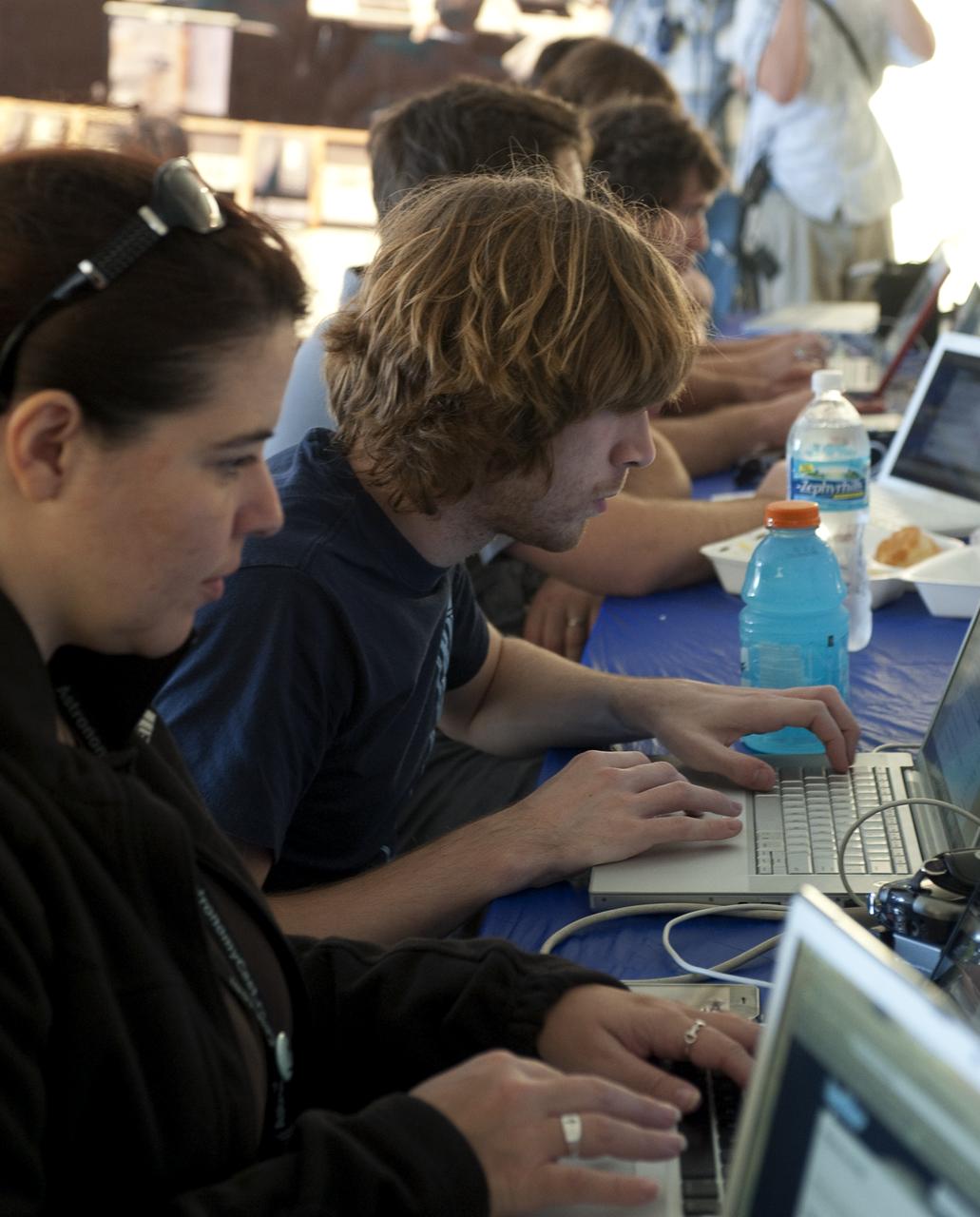 Attendees at a two-day NASA Tweetup at Kennedy Space Center twitter live about their impressions during the Tweetup in Cape Canaveral, Fla., Sunday, Nov. 15, 2009.  NASA Twitter followers in attendance will have the opportunity to take a tour of NASA's Kennedy Space Center, view the STS-129 space shuttle launch and speak with shuttle technicians, engineers, astronauts and managers.  Photo Credit: (NASA/Carla Cioffi)