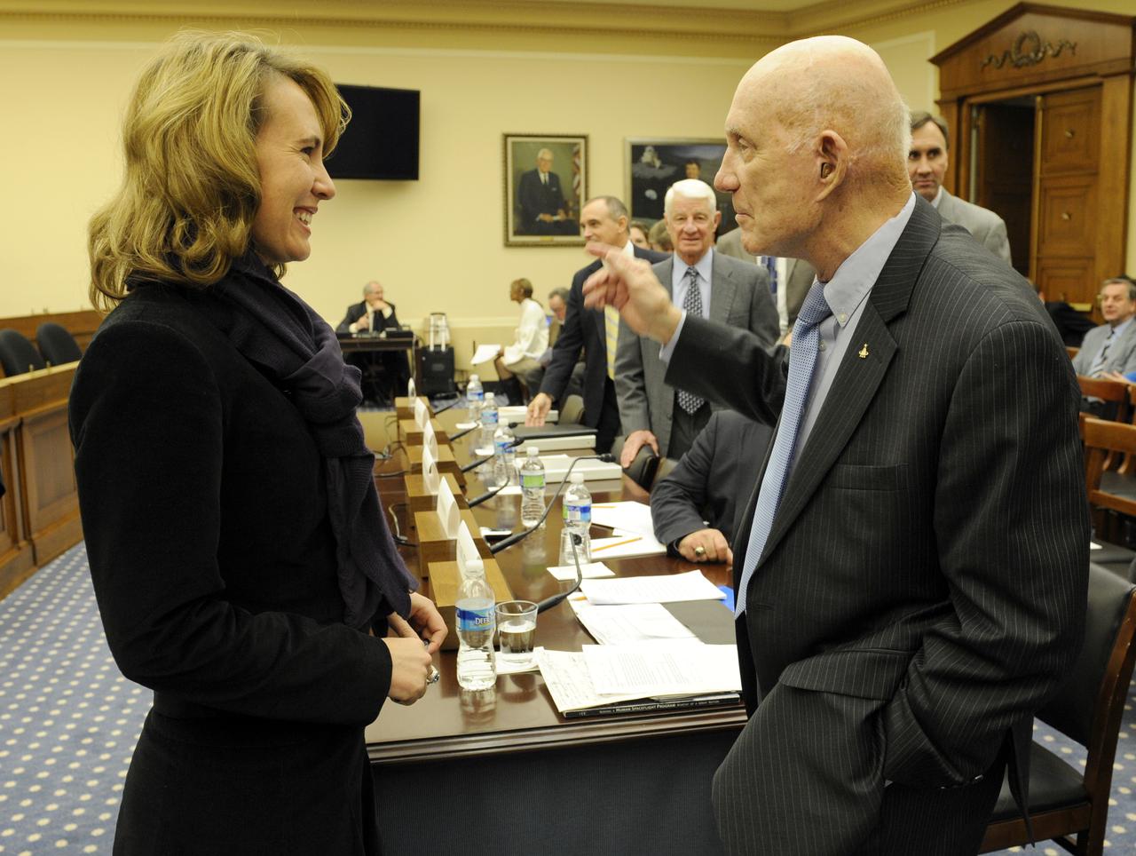 U.S. Rep. Gabrielle Giffords, D-Ariz., left, speaks with reitred astronaut Lt. Gen. Thomas Stafford prior to the start of a hearing before the House Subcommitte on Space and Aeronautics regarding Safety of Human Spaceflight on Capitol Hill, Wednesday, Dec. 2, 2009, in Washington.  Photo Credit: (NASA/Bill Ingalls)
