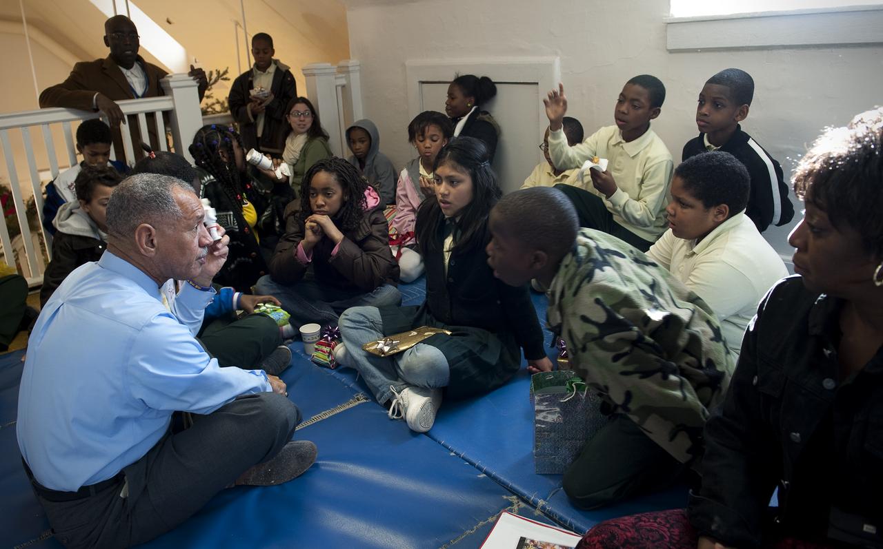NASA Administrator Charles Bolden spent time volunteering with DC Cares at the Park View Recreation Center in Washington, DC for their Santa's Workshop program, Monday, Dec. 14, 2009.  Mr. Bolden spoke with students about his experience as a former NASA astronaut and current NASA Administrator, encouraging them to study math and science and to stay in school.  Photo Credit:  (NASA/Bill Ingalls)