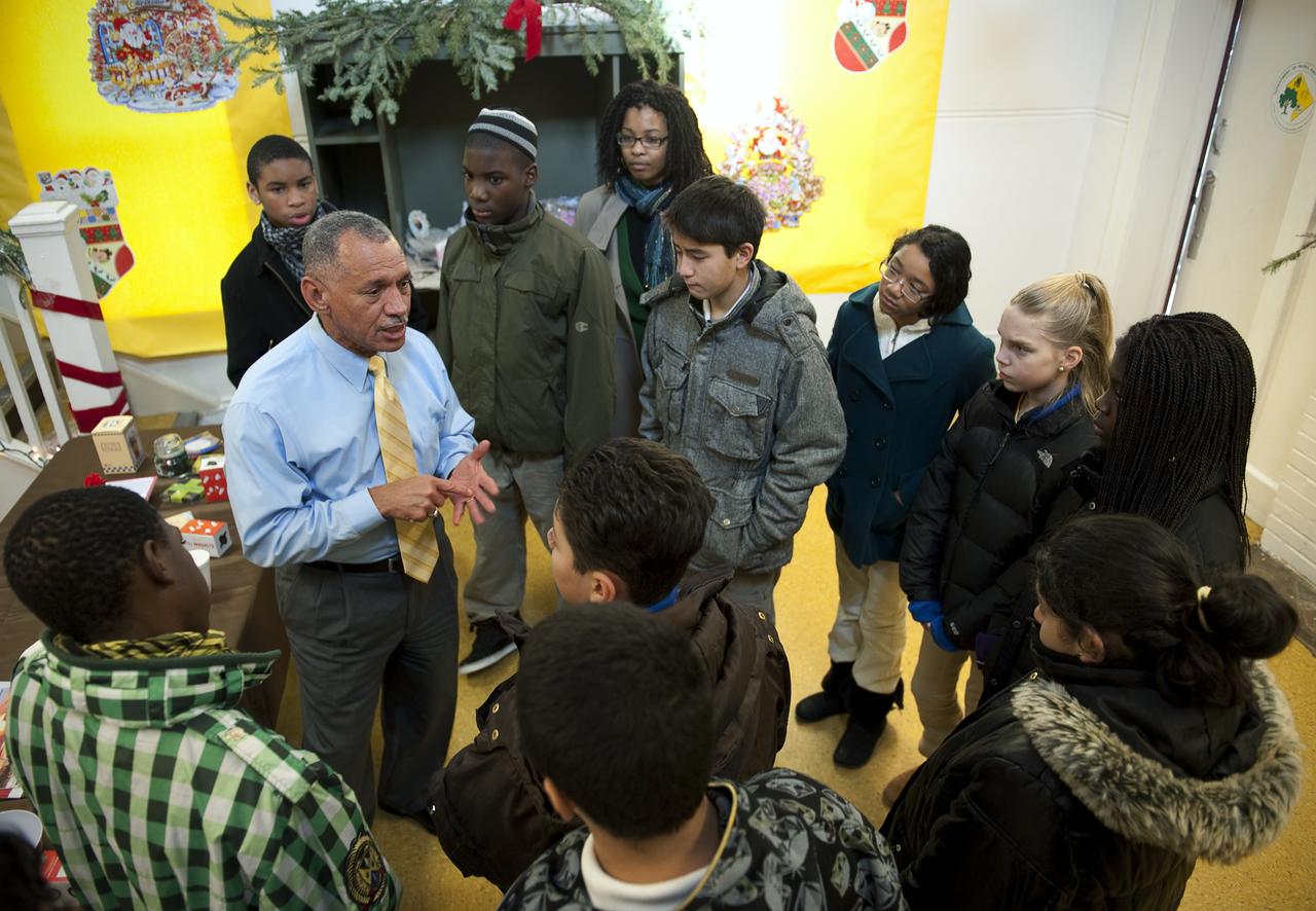 NASA Administrator Charles Bolden spent time volunteering with DC Cares at the Park View Recreation Center in Washington, DC for their Santa's Workshop program, Monday, Dec. 14, 2009.  Mr. Bolden spoke with students about his experience as a former NASA astronaut and current NASA Administrator, encouraging them to study math and science and to stay in school.  Photo Credit:  (NASA/Bill Ingalls)
