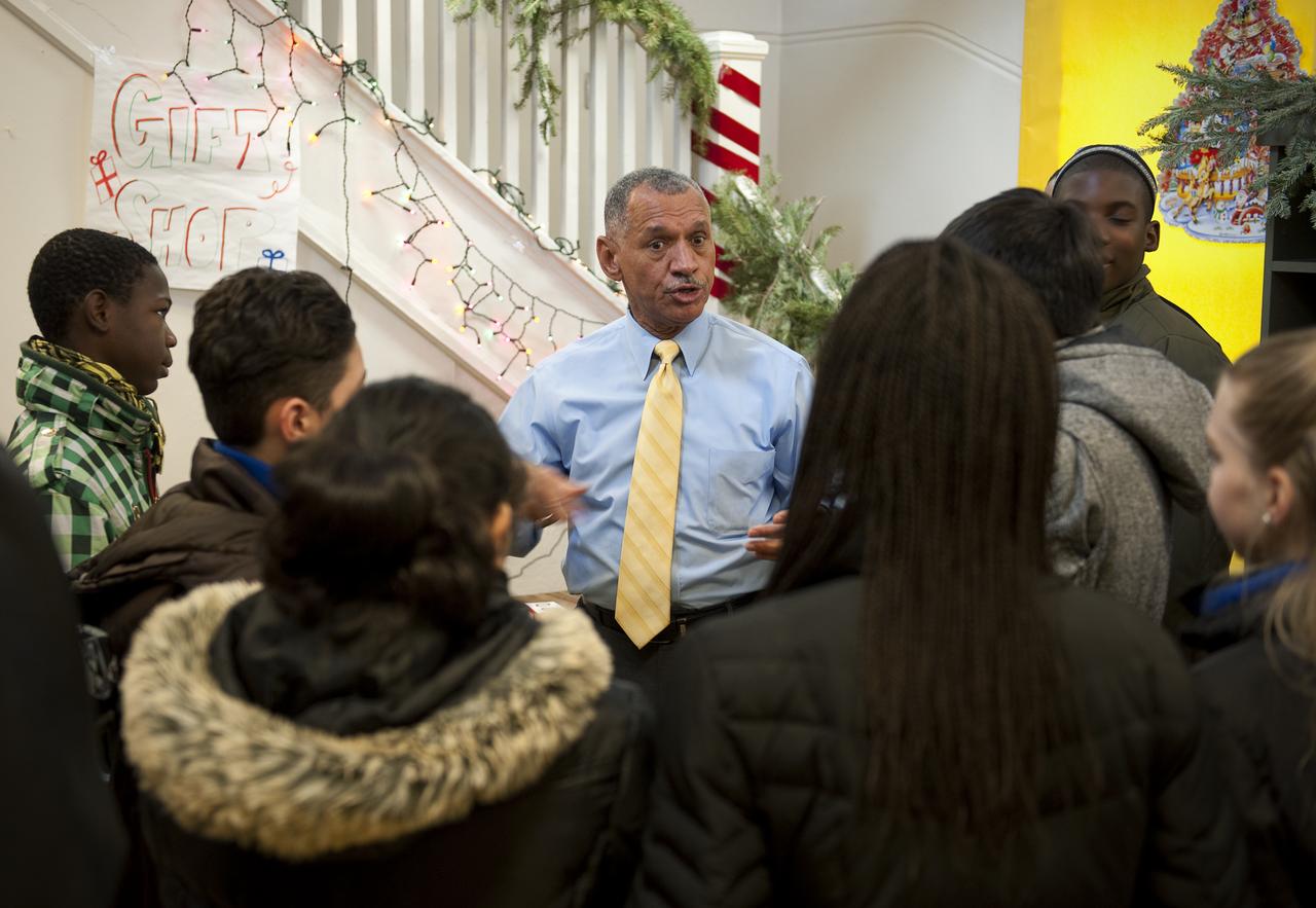NASA Administrator Charles Bolden spent time volunteering with DC Cares at the Park View Recreation Center in Washington, DC for their Santa's Workshop program, Monday, Dec. 14, 2009.  Mr. Bolden spoke with students about his experience as a former NASA astronaut and current NASA Administrator, encouraging them to study math and science and to stay in school.  Photo Credit:  (NASA/Bill Ingalls)