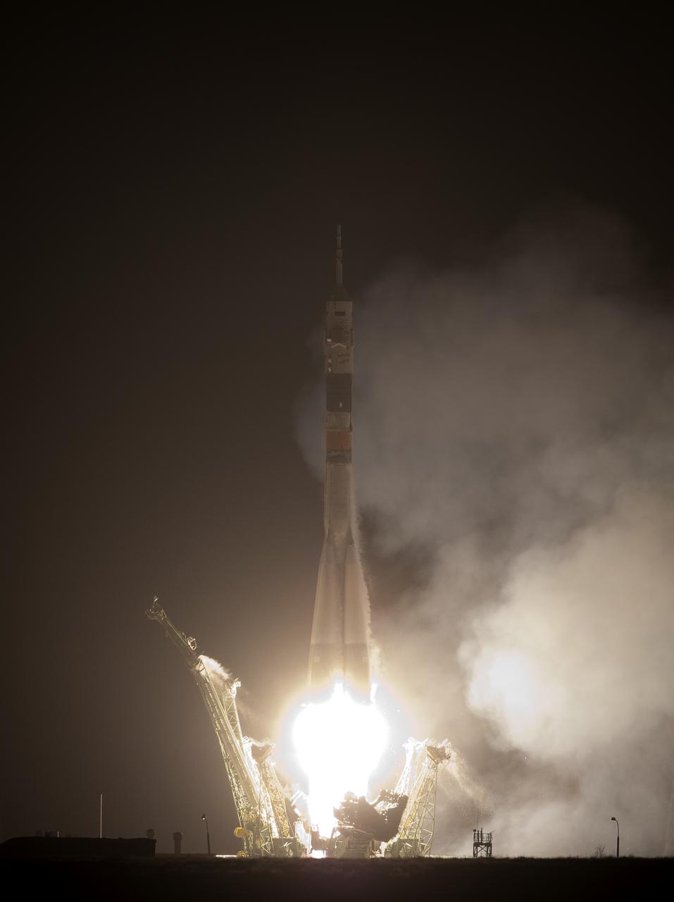 The Soyuz TMA-17 rocket launches from the Baikonur Cosmodrome in Kazakhstan on Monday, Dec. 21, 2009 carrying Expedition 22 NASA Flight Engineer Timothy J. Creamer of the U.S., Soyuz Commander Oleg Kotov of Russia and Flight Engineer Soichi Noguchi of Japan to the International Space Station. (Photo Credit: NASA/Bill Ingalls)