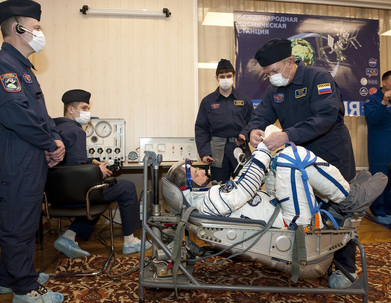 Expedition 22 NASA Flight Engineer Timothy J. Creamer of the U.S. prepares to have his Russian Sokol suit pressure checked at the Baikonur Cosmodrome in Baikonur, Kazakhstan, Monday, Dec. 21, 2009. Creamer and fellow Expedition 22 crew members, Soyuz Commander Oleg Kotov of Russia, and Flight Engineer Soichi Noguchi of Japan launched in their Soyuz TMA-17 rocket from the Baikonur Cosmodrome in Kazakhstan on Monday, Dec. 21, 2009. (Photo Credit: NASA/Bill Ingalls)