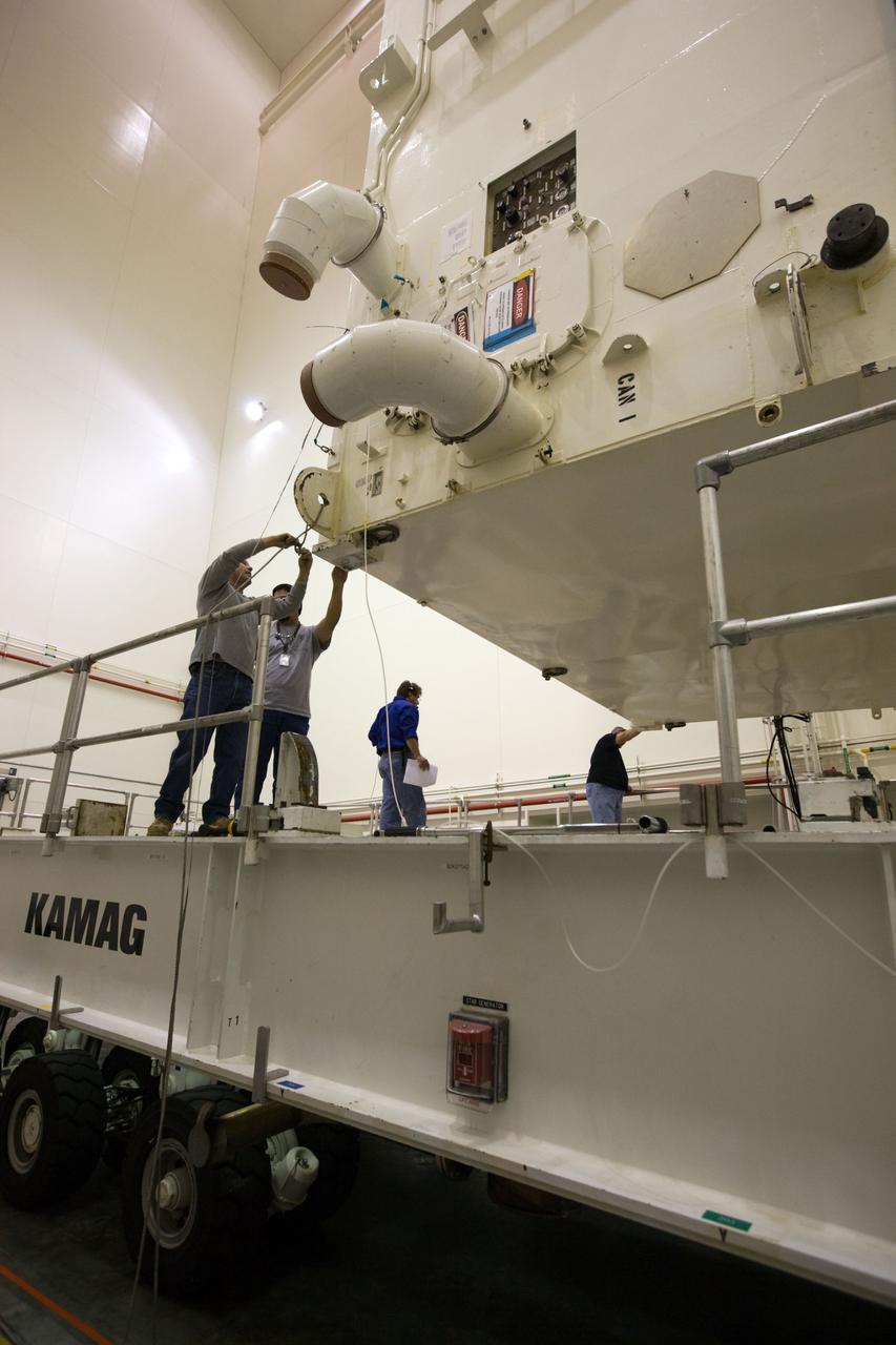 STS-130 PAYLOAD CANISTER TURN FROM HORIZONAL TO VERTICAL