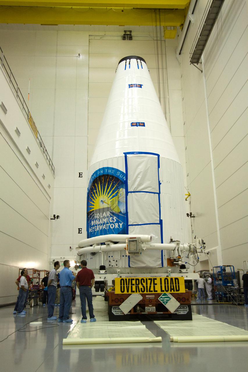 CAPE CANAVERAL, Fla. – At the Astrotech Space Operations facility in Titusville, Fla., NASA's Solar Dynamics Observatory, or SDO, enclosed in the Atlas V payload fairing, is secured onto a transporter in the airlock in preparation for its move to the pad.  SDO is the first mission in NASA's Living With a Star Program and is designed to study the causes of solar variability and its impacts on Earth. The spacecraft's long-term measurements will give solar scientists in-depth information to help characterize the interior of the Sun, the Sun's magnetic field, the hot plasma of the solar corona, and the density of radiation that creates the ionosphere of the planets. The information will be used to create better forecasts of space weather needed to protect the aircraft, satellites and astronauts living and working in space. Liftoff aboard an Atlas V rocket is targeted for Feb. 9 from Launch Complex 41 on Cape Canaveral Air Force Station. For information on SDO, visit http:__www.nasa.gov_sdo.  Photo credit: NASA_Jack Pfaller