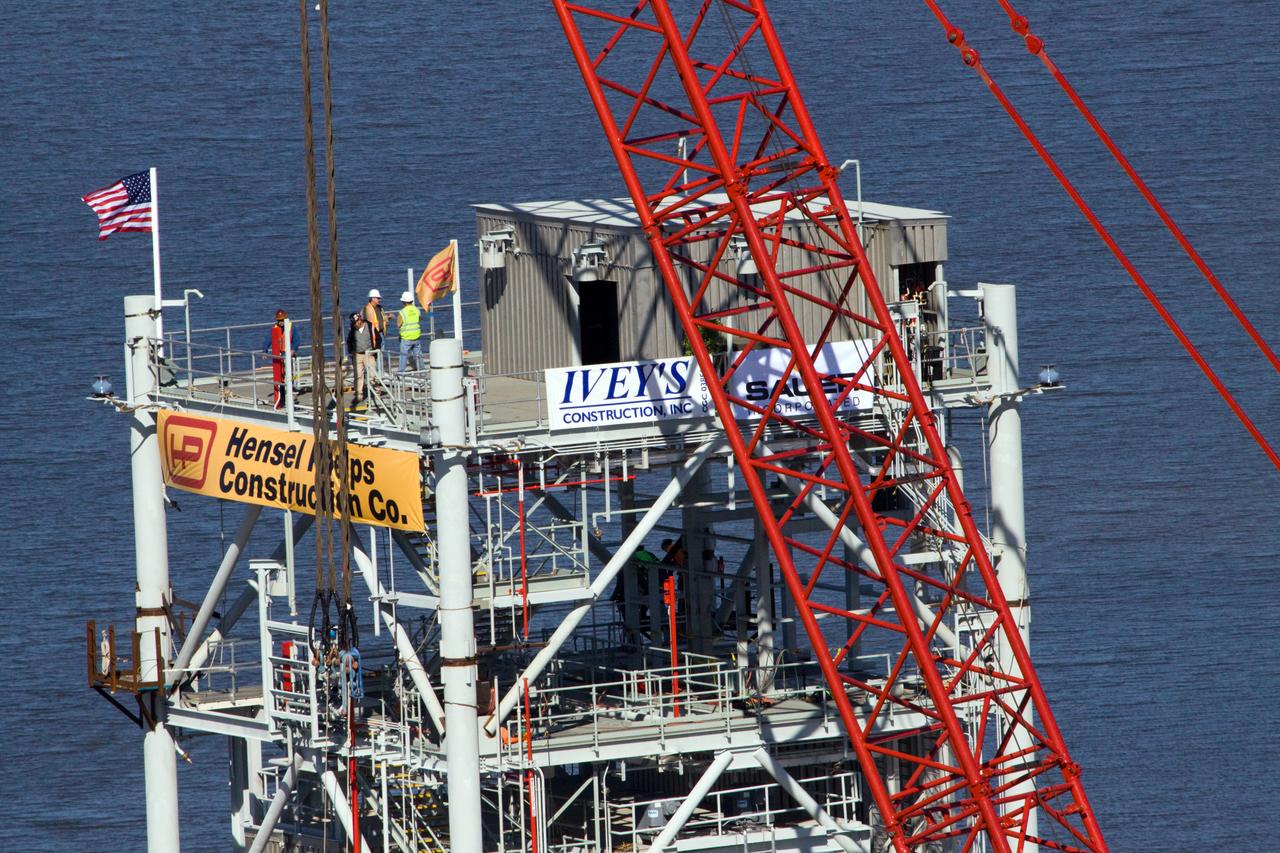 CONSTELLATION - NEW MLP CONSTRUCTION PROGRESS - 10TH SEGMENT TOWER LIFT - AS SEEN FROM VAB ROOF