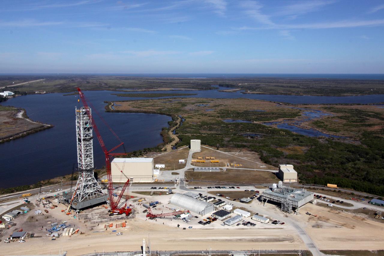 CONSTELLATION - NEW MLP CONSTRUCTION PROGRESS - 10TH SEGMENT TOWER LIFT - AS SEEN FROM VAB ROOF