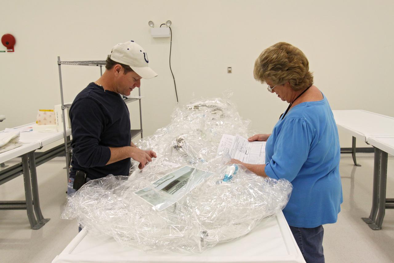 CAPE CANAVERAL, Fla. – In the Space Station Processing Facility at NASA's Kennedy Space Center in Florida, workers begin processing of the newly arrived replacement high-pressure ammonia jumper hoses to support space shuttle Endeavour's STS-130 mission.  A problem arose during a prelaunch test Jan. 7 with one of four hoses that are needed to connect the ammonia loops of the International Space Station's Tranquility node to those of the Destiny laboratory.  A decision was made to use an alternate hose design for use as the primary jumper.  The new hoses are assembled from shorter hoses that were previously certified and tested.  Connection of the modules requires two ammonia loops, with two lines apiece, each of which must be connected to both Tranquility and Destiny to route cooling to and from the Tranquility module.  The primary payload for the STS-130 mission, Tranquility is a pressurized module that will provide additional room for crew members and many of the station's life support and environmental control systems. The node was built in Turin, Italy, by Thales Alenia Space for the European Space Agency.  Endeavour's launch is set for Feb. 7.  For information on the STS-130 mission and crew, visit http:__www.nasa.gov_mission_pages_shuttle_shuttlemissions_sts130_index.html.  Photo credit: NASA_Jack Pfaller