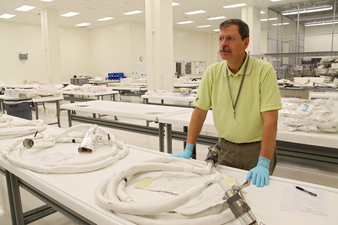 CAPE CANAVERAL, Fla. – In the Space Station Processing Facility at NASA's Kennedy Space Center in Florida, the newly arrived replacement high-pressure ammonia jumper hoses to support space shuttle Endeavour's STS-130 mission are positioned along work tables and ready for testing.  A problem arose during a prelaunch test Jan. 7 with one of four hoses that are needed to connect the ammonia loops of the International Space Station's Tranquility node to those of the Destiny laboratory.  A decision was made to use an alternate hose design for use as the primary jumper.  The new hoses are assembled from shorter hoses that were previously certified and tested.  Connection of the modules requires two ammonia loops, with two lines apiece, each of which must be connected to both Tranquility and Destiny to route cooling to and from the Tranquility module.  The primary payload for the STS-130 mission, Tranquility is a pressurized module that will provide additional room for crew members and many of the station's life support and environmental control systems. The node was built in Turin, Italy, by Thales Alenia Space for the European Space Agency.  Endeavour's launch is set for Feb. 7.  For information on the STS-130 mission and crew, visit http:__www.nasa.gov_mission_pages_shuttle_shuttlemissions_sts130_index.html.  Photo credit: NASA_Jack Pfaller