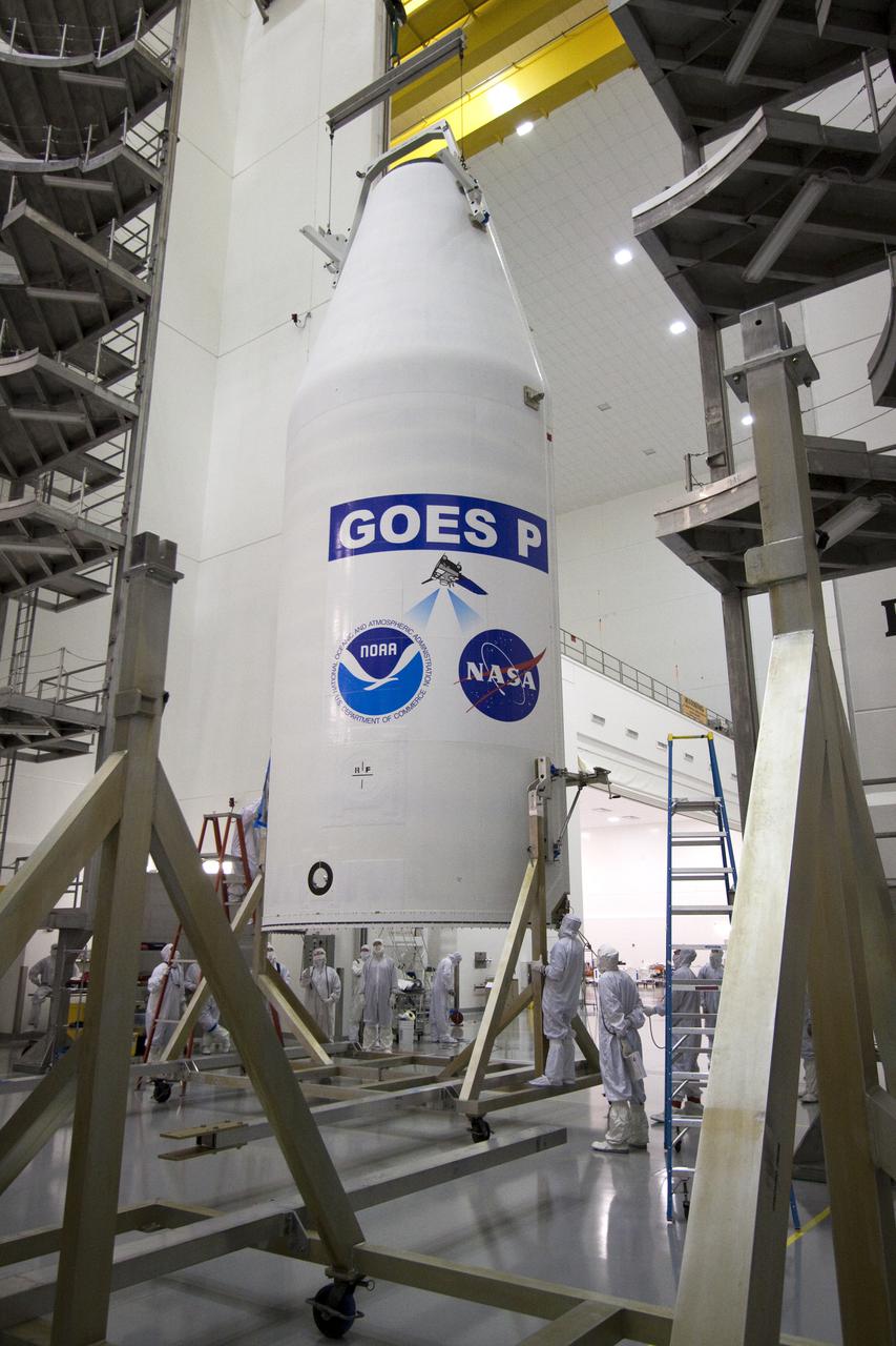 CAPE CANAVERAL, Fla. – At the Astrotech Space Operations facility in Titusville, Fla., preparations are under way to release one side of the Delta IV payload fairing that will enclose NASA's GOES-P meteorological satellite from its work stand. The fairing is a molded clamshell covering that fits flush with the outside surface of the rocket and forms an aerodynamic nose cone, protecting the spacecraft during launch and ascent. GOES-P, the latest Geostationary Operational Environmental Satellite, was developed by NASA for the National Oceanic and Atmospheric Administration, or NOAA. GOES-P is designed to watch for storm development and observed current weather conditions on Earth. Launch of GOES-P is targeted for March 1 from Launch Complex 37 aboard a United Launch Alliance Delta IV rocket. For information on GOES-P, visit http:__www.nasa.gov_mission_pages_GOES-P_main_index.html. Photo credit: NASA_Jack Pfaller