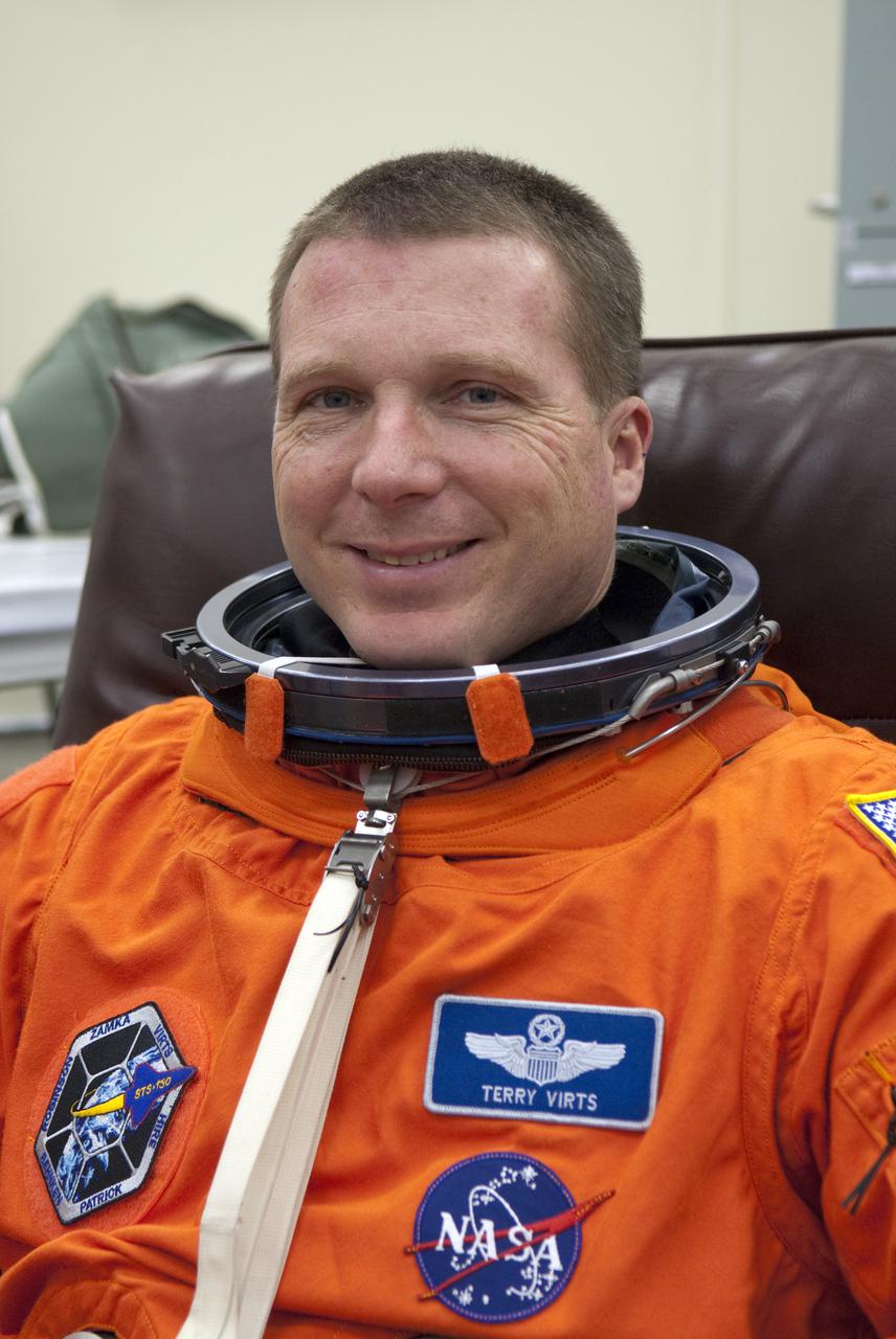 CAPE CANAVERAL, Fla. - In the Operations and Checkout Building at NASA's Kennedy Space Center in Florida, the astronauts of space shuttle Endeavour's STS-130 crew put on their launch-and-entry suits before heading to the Astrovan for the ride to Launch Pad 39A.  Pilot Terry Virts, seen here, is looking forward to launch.  The primary payload for the STS-130 mission to the International Space Station is the Tranquility node, a pressurized module that will provide additional room for crew members and many of the station's life support and environmental control systems. Attached to one end of Tranquility is a cupola, a unique work area with six windows on its sides and one on top.  The cupola resembles a circular bay window and will provide a vastly improved view of the station's exterior. The multi-directional view will allow the crew to monitor spacewalks and docking operations, as well as provide a spectacular view of Earth and other celestial objects. The module was built in Turin, Italy, by Thales Alenia Space for the European Space Agency.  Endeavour's launch is set for Feb. 7 at 4:39 a.m. EST.  For information on the STS-130 mission and crew, visit http:__www.nasa.gov_mission_pages_shuttle_shuttlemissions_sts130_index.html.  Photo credit: NASA_Kim Shiflett
