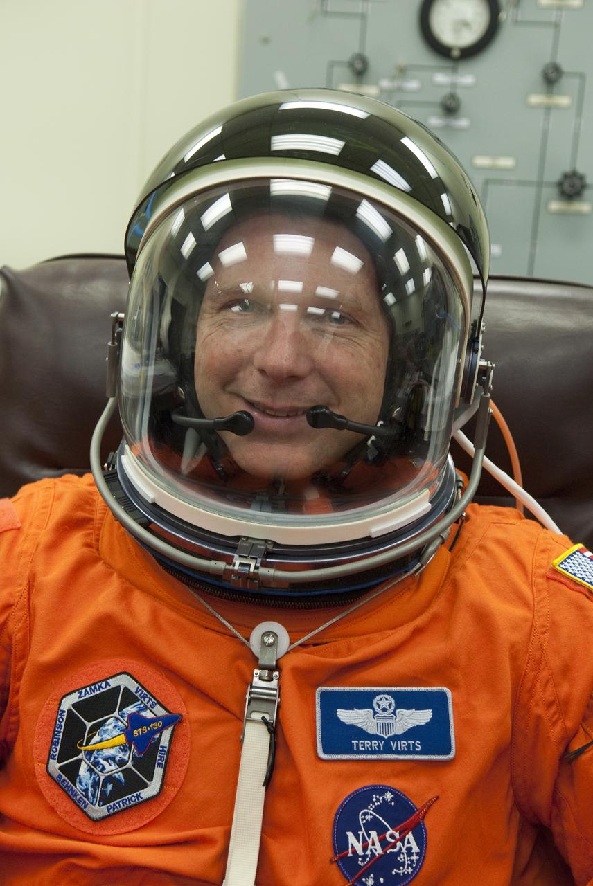 CAPE CANAVERAL, Fla. - In the Operations and Checkout Building at NASA's Kennedy Space Center in Florida, the astronauts of space shuttle Endeavour's STS-130 crew put on their launch-and-entry suits before heading to the Astrovan for the ride to Launch Pad 39A.  Pilot Terry Virts, seen here, checks the fit of his suit's helmet.  The primary payload for the STS-130 mission to the International Space Station is the Tranquility node, a pressurized module that will provide additional room for crew members and many of the station's life support and environmental control systems. Attached to one end of Tranquility is a cupola, a unique work area with six windows on its sides and one on top.  The cupola resembles a circular bay window and will provide a vastly improved view of the station's exterior. The multi-directional view will allow the crew to monitor spacewalks and docking operations, as well as provide a spectacular view of Earth and other celestial objects. The module was built in Turin, Italy, by Thales Alenia Space for the European Space Agency.  Endeavour's launch is set for Feb. 7 at 4:39 a.m. EST.  For information on the STS-130 mission and crew, visit http:__www.nasa.gov_mission_pages_shuttle_shuttlemissions_sts130_index.html.  Photo credit: NASA_Kim Shiflett