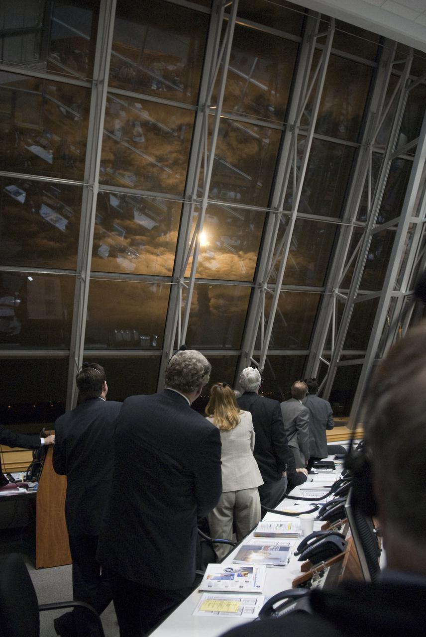 CAPE CANAVERAL, Fla. - NASA managers watch the liftoff of space shuttle Endeavour through the windows of Firing Room 4 in the Launch Control Center at NASA's Kennedy Space Center in Florida.  Launch of Endeavour on the STS-130 mission to the International Space Station was at 4:14 a.m. EST.  This was the second launch attempt for space shuttle Endeavour's STS-130 crew and the final scheduled space shuttle night launch.  The first attempt on Feb. 7 was scrubbed due to unfavorable weather. The primary payload for the STS-130 mission to the International Space Station is the Tranquility node, a pressurized module that will provide additional room for crew members and many of the station's life support and environmental control systems. Attached to one end of Tranquility is a cupola, a unique work area with six windows on its sides and one on top.  The cupola resembles a circular bay window and will provide a vastly improved view of the station's exterior. The multi-directional view will allow the crew to monitor spacewalks and docking operations, as well as provide a spectacular view of Earth and other celestial objects. The module was built in Turin, Italy, by Thales Alenia Space for the European Space Agency.  For information on the STS-130 mission and crew, visit http:__www.nasa.gov_mission_pages_shuttle_shuttlemissions_sts130_index.html.  Photo credit: NASA_Kim Shiflett