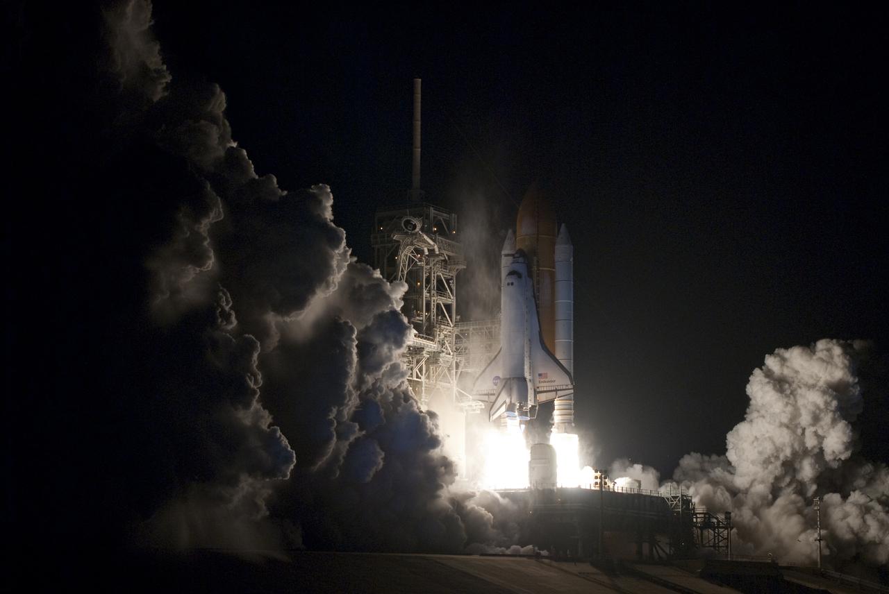 CAPE CANAVERAL, Fla. - An exhaust cloud forms at Launch Pad 39A at NASA's Kennedy Space Center in Florida as space shuttle Endeavour lifts off into the predawn sky.  Launch of the STS-130 mission to the International Space Station was at 4:14 a.m. EST.  This was the second launch attempt for space shuttle Endeavour's STS-130 crew and the final scheduled space shuttle night launch.  The first attempt on Feb. 7 was scrubbed due to unfavorable weather. The primary payload for the STS-130 mission to the International Space Station is the Tranquility node, a pressurized module that will provide additional room for crew members and many of the station's life support and environmental control systems. Attached to one end of Tranquility is a cupola, a unique work area with six windows on its sides and one on top.  The cupola resembles a circular bay window and will provide a vastly improved view of the station's exterior. The multi-directional view will allow the crew to monitor spacewalks and docking operations, as well as provide a spectacular view of Earth and other celestial objects. The module was built in Turin, Italy, by Thales Alenia Space for the European Space Agency.  For information on the STS-130 mission and crew, visit http:__www.nasa.gov_mission_pages_shuttle_shuttlemissions_sts130_index.html.  Photo credit: NASA_Sandra Joseph and Kevin O'Connell